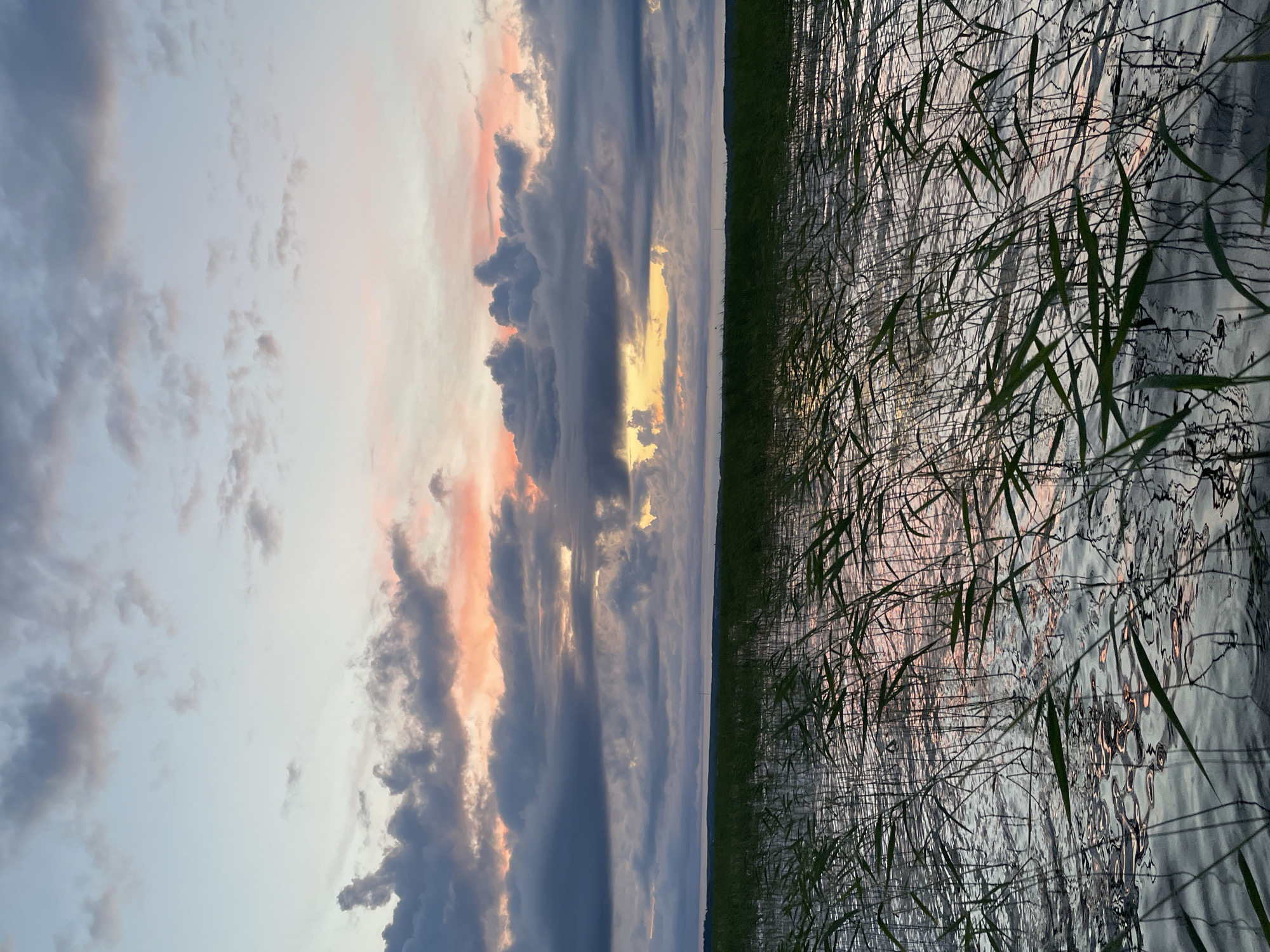 Evening on the lake: boating, swimming, and a quiet Russian sunset.