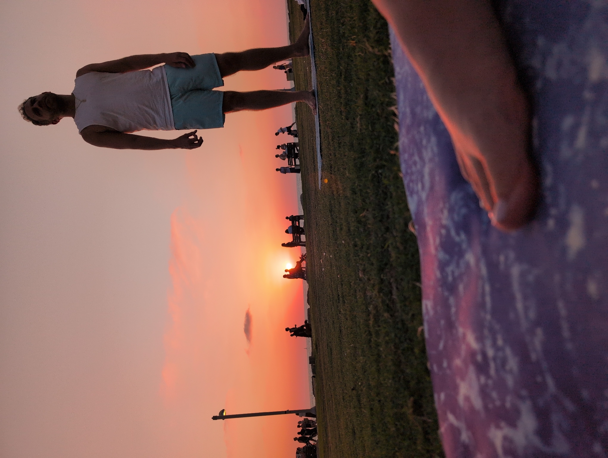 Yoga on the grass as the Mediterranean sun goes down