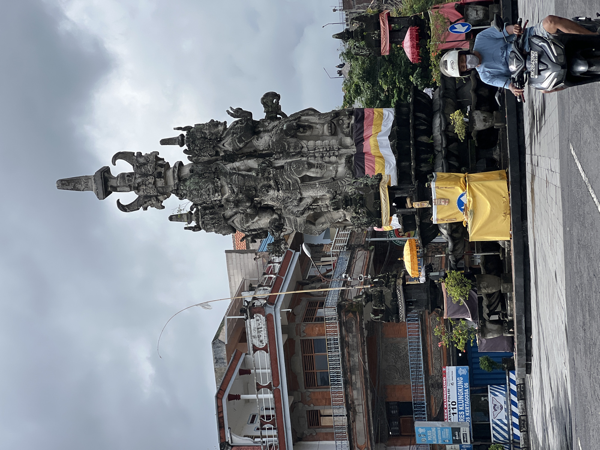 Goa Lawah Temple's gate and monument on a cloudy Klungkung morning