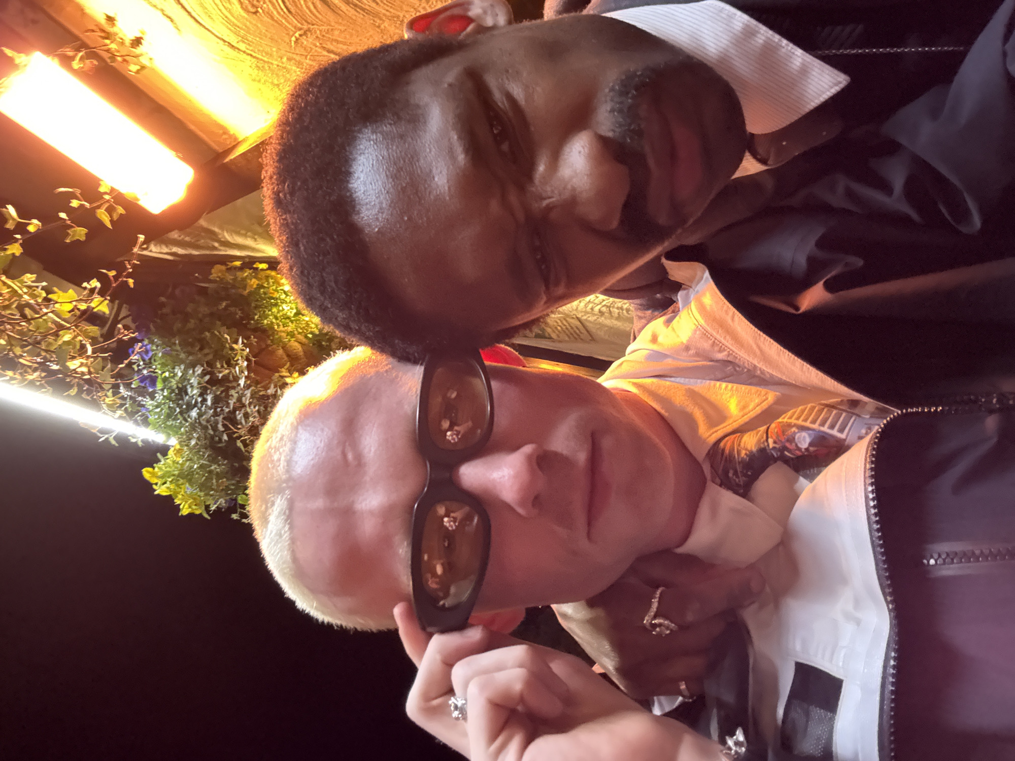 Two people photographed together in close-range selfie in London