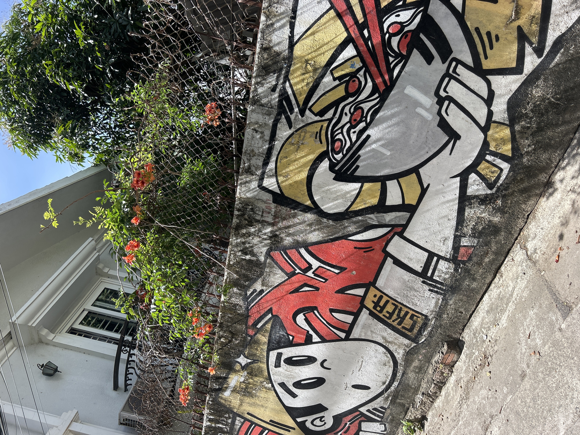Vietnamese street art featuring sheep in conical hats documented