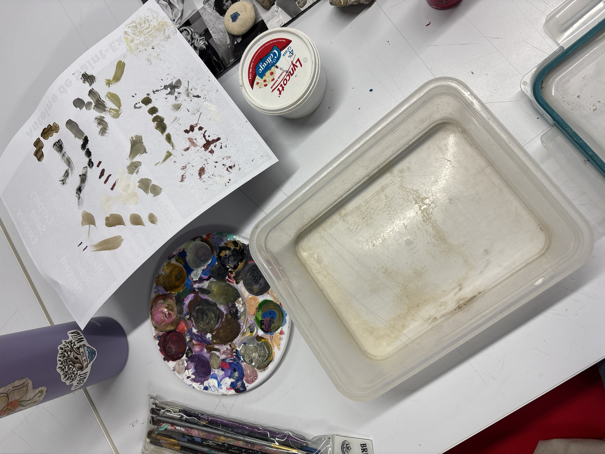 Artist workspace with paints and mineral collection documented Mexico City