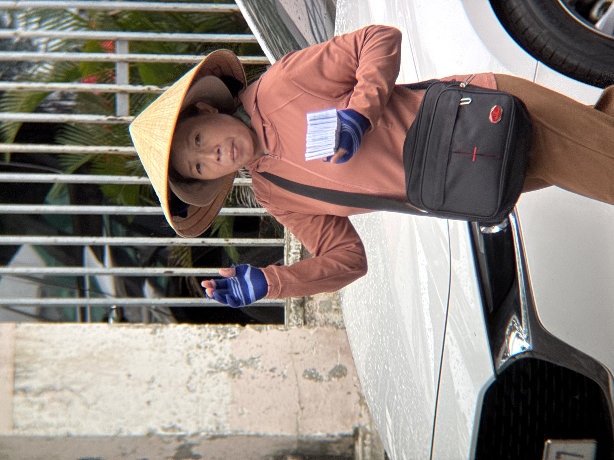 Wet street traffic and vendors on a Nha Trang morning