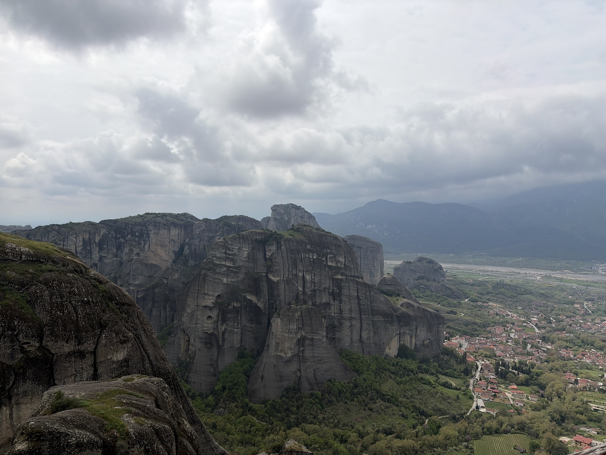 Tourist captures panoramic views of Meteora formations near Kastraki