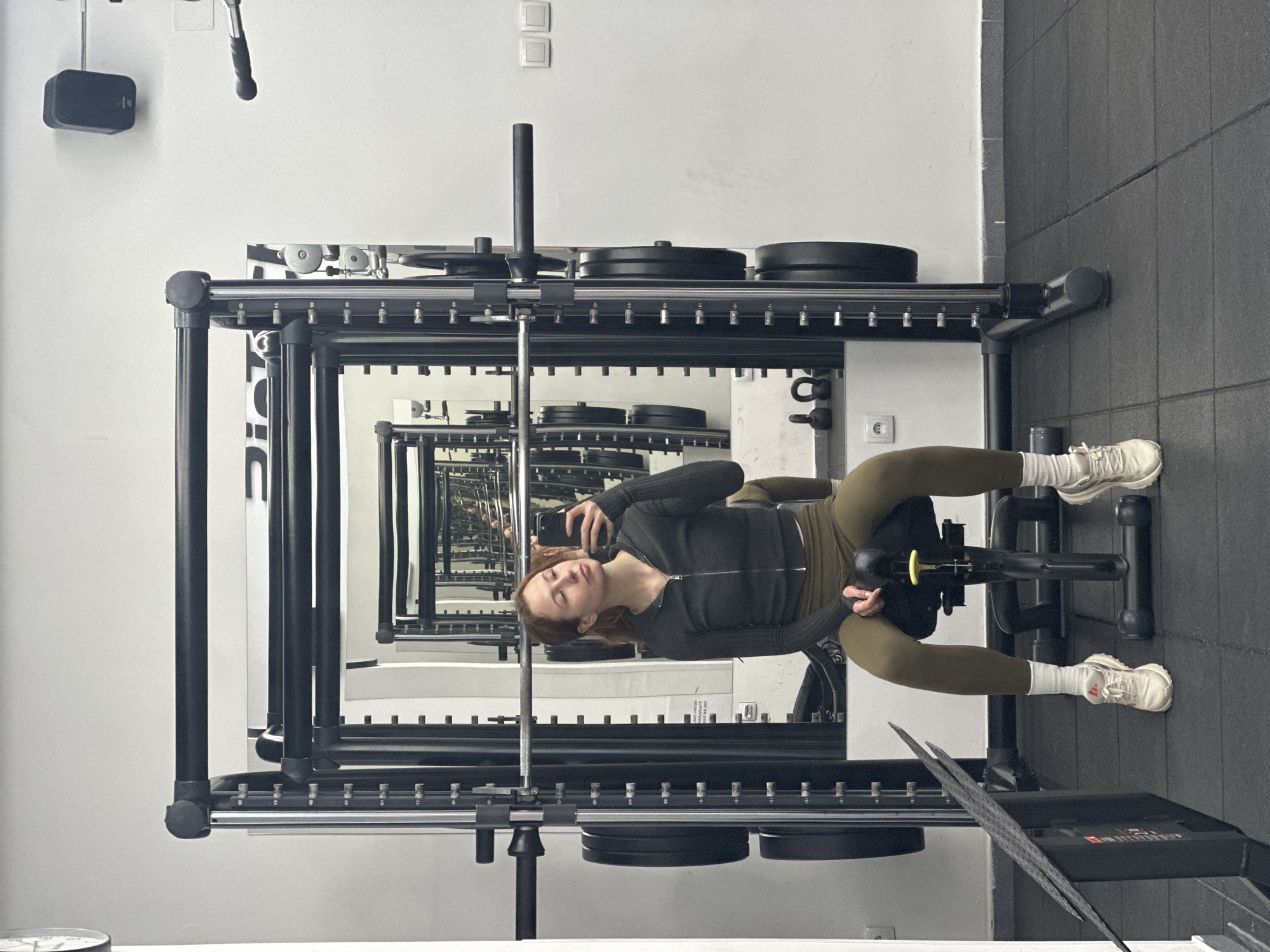 Person exercises on leg machine at Novi Sad gym