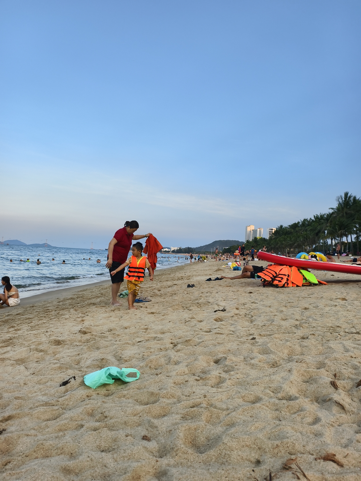 Urban beach activities and loaded motorcycle observed