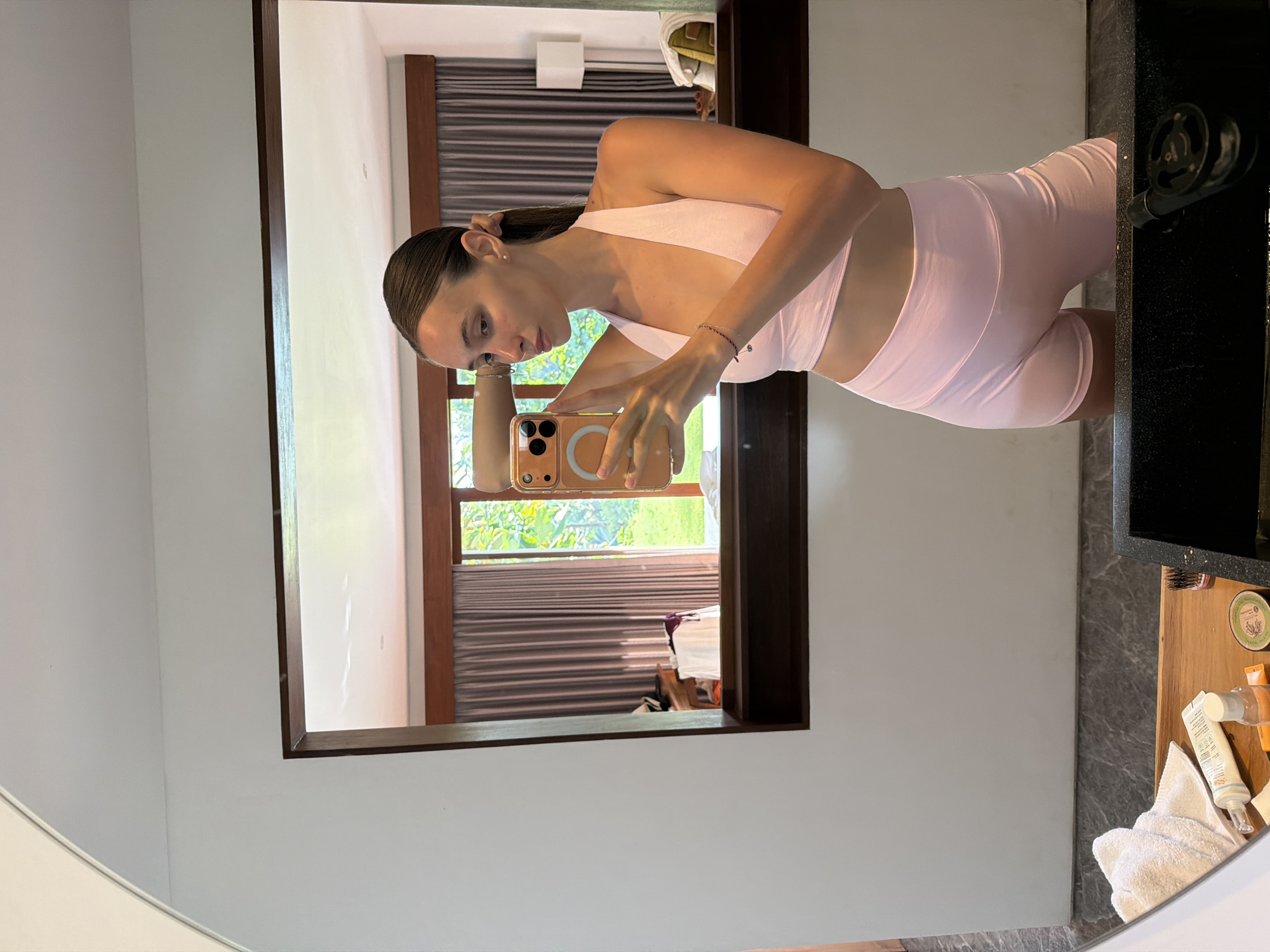 Woman documents morning routine with selfies at Petulu residence