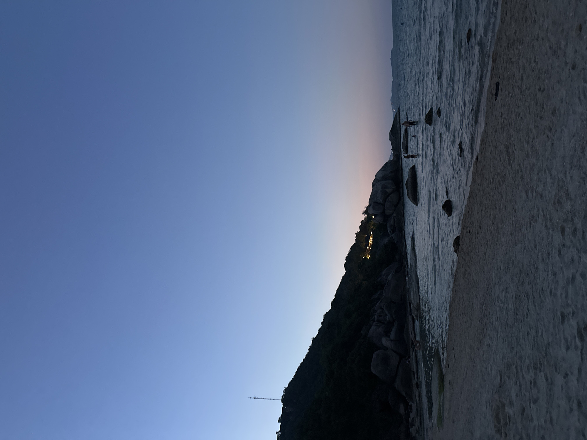 Twilight beach moment with watermelon snack in Thailand