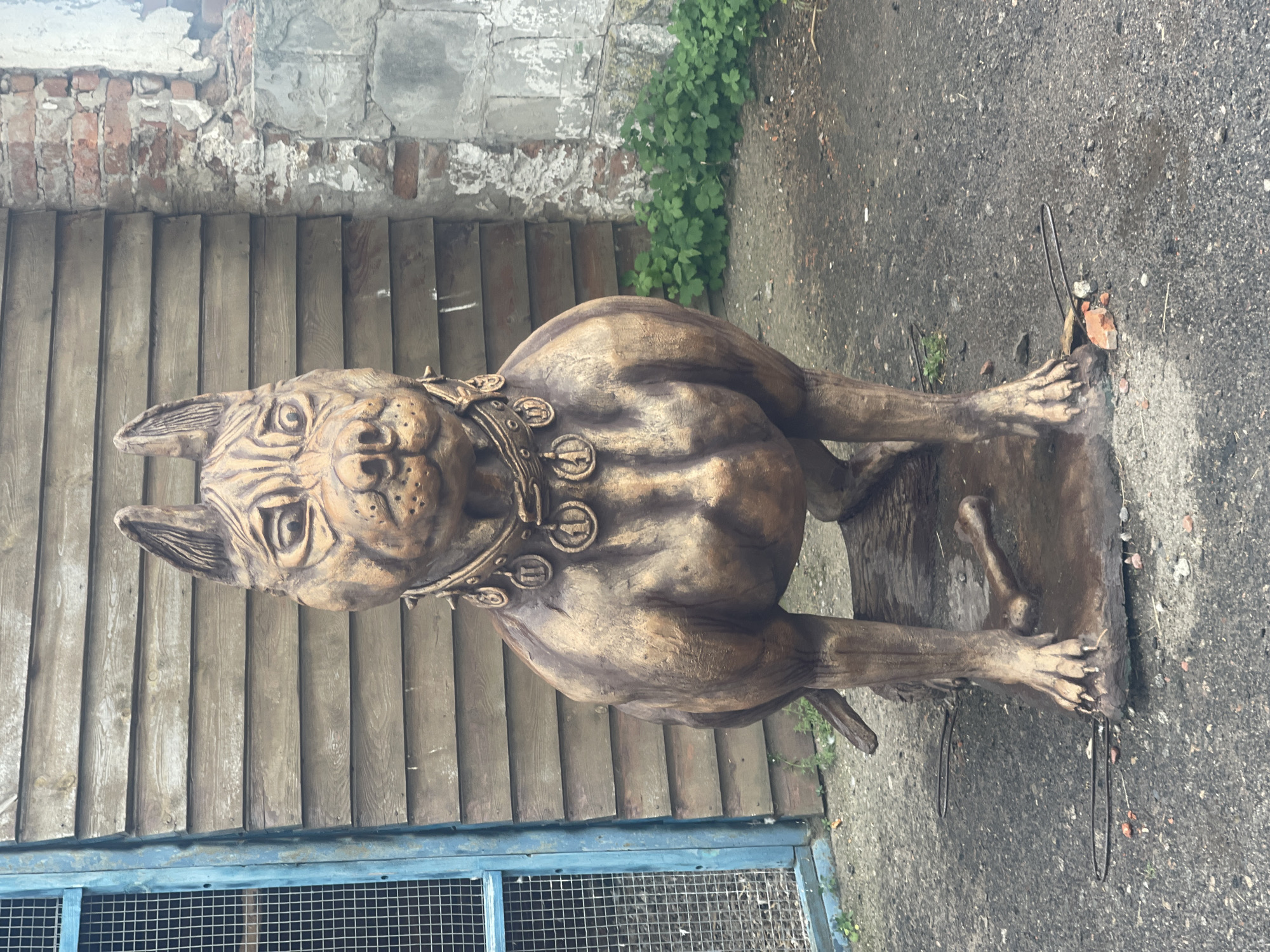 Park visitors document art installations during rainy afternoon