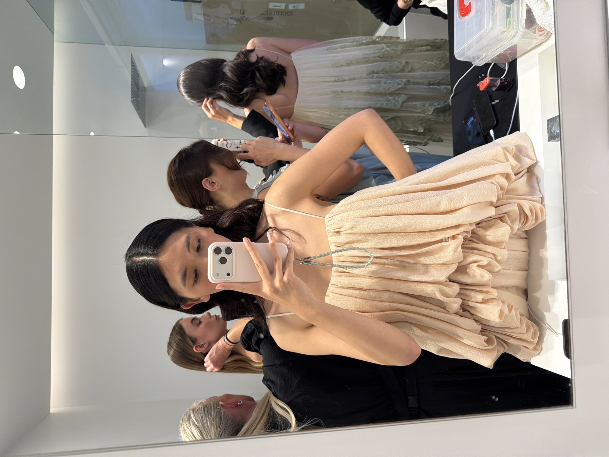 Woman takes backstage selfie in crowded Ramatuelle dressing room