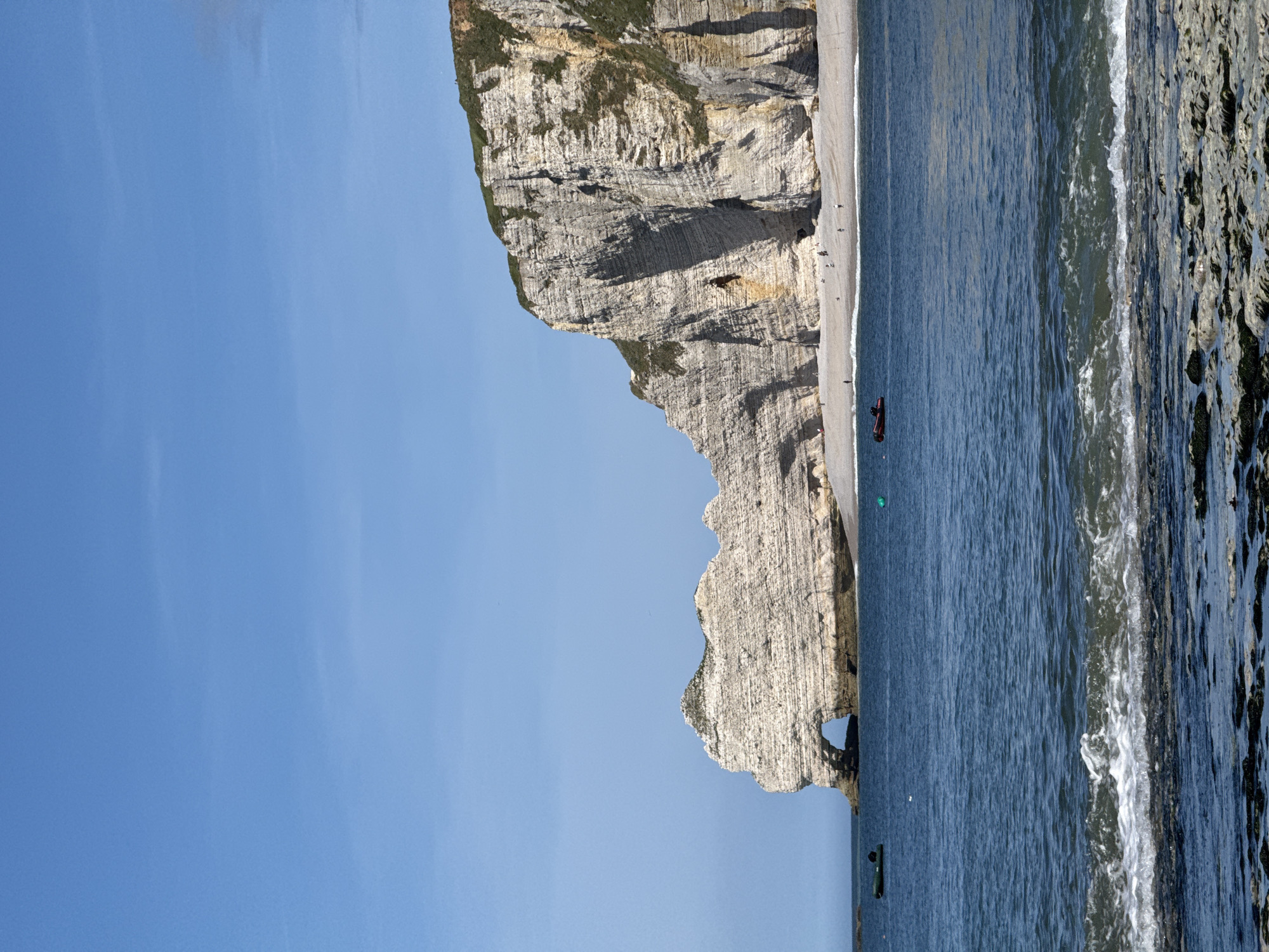 Tourist documents iconic Étretat cliffs and town views