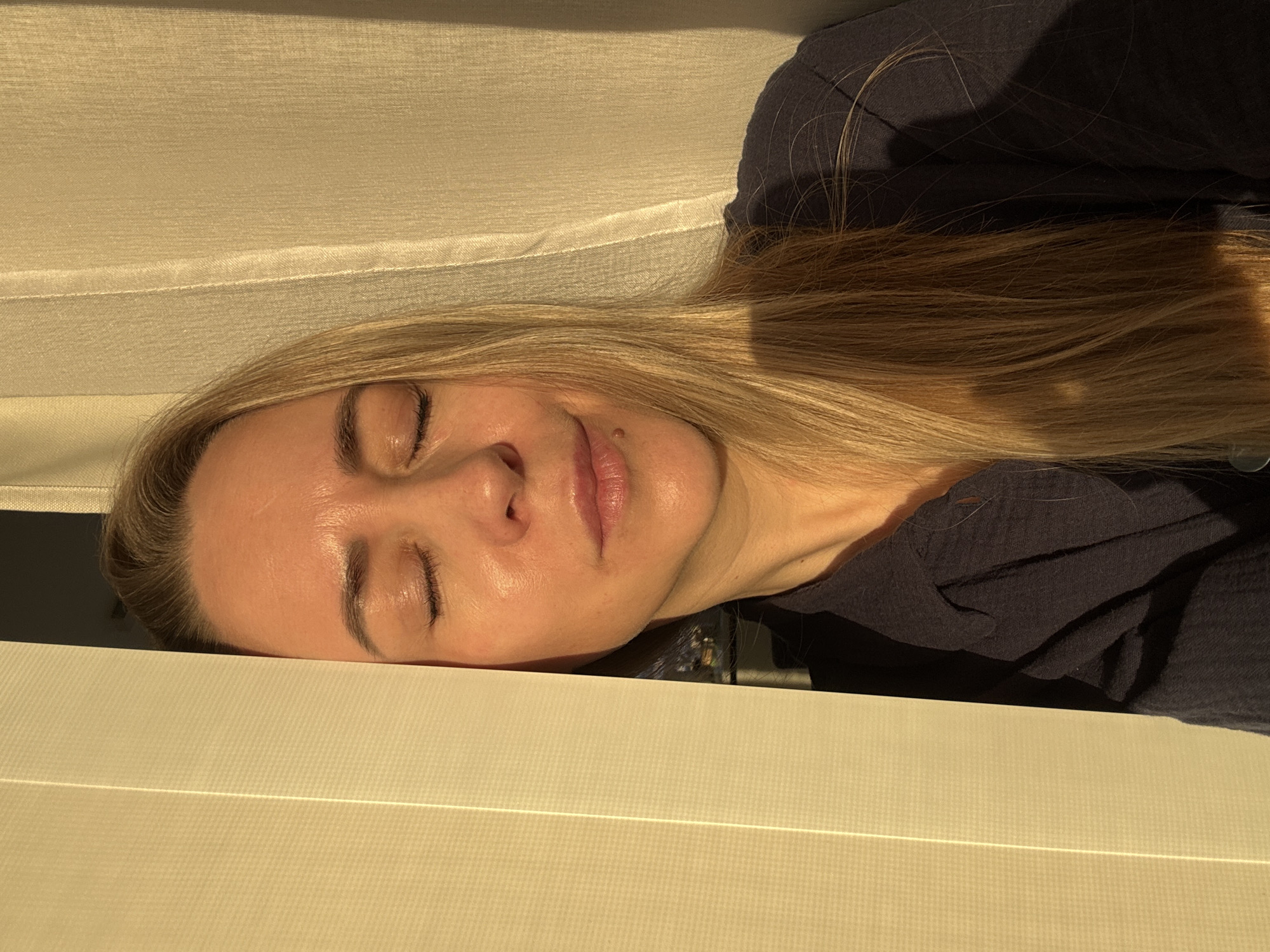 Woman photographed resting indoors in Chaikovsky, Russia