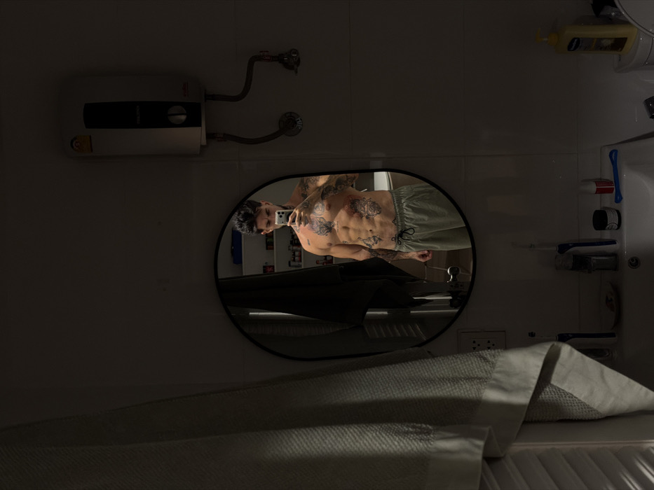 Man takes mirror selfies in Bangkok interior