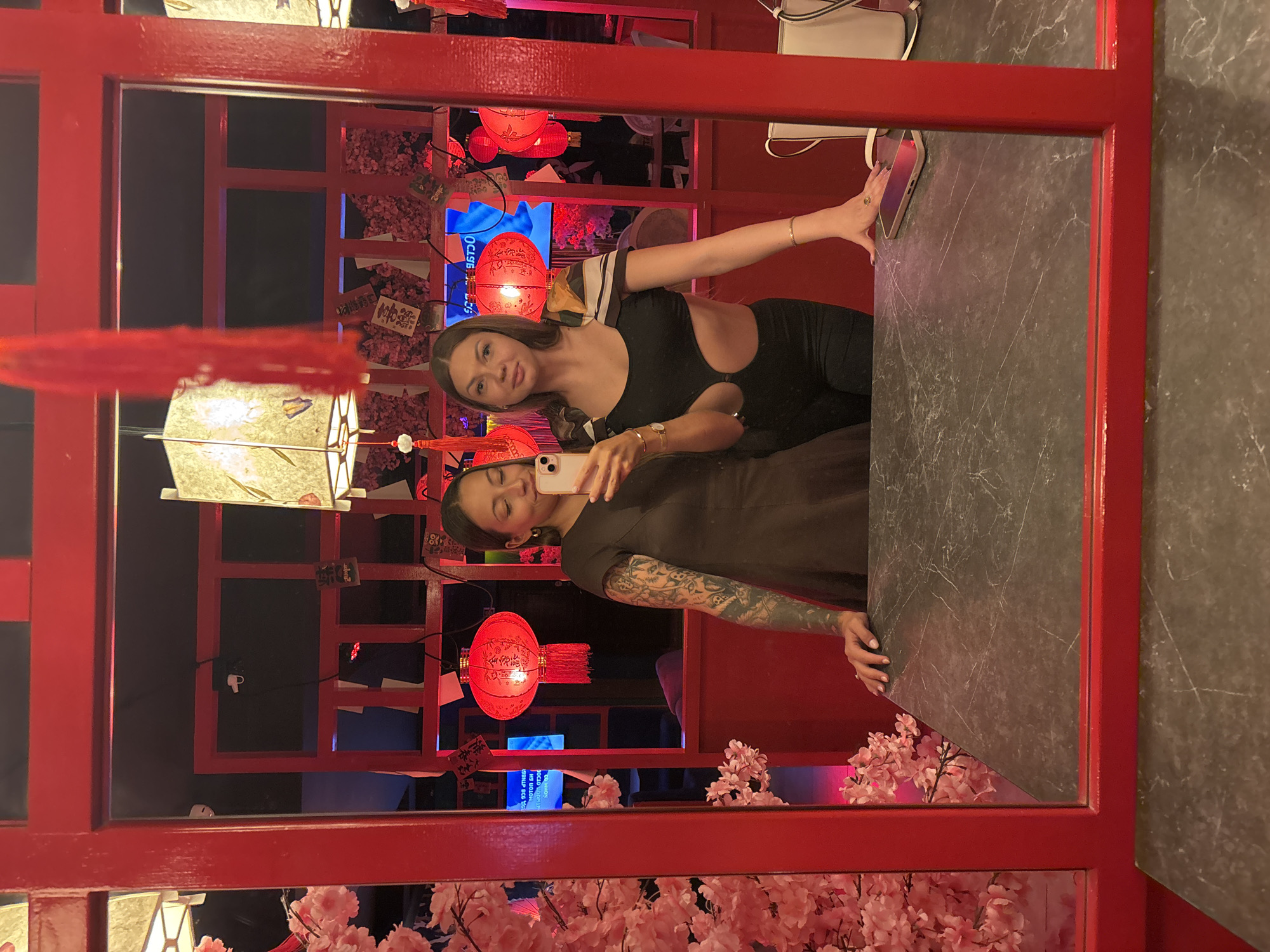 Woman documents Asian-themed restaurant interior in Saint Petersburg