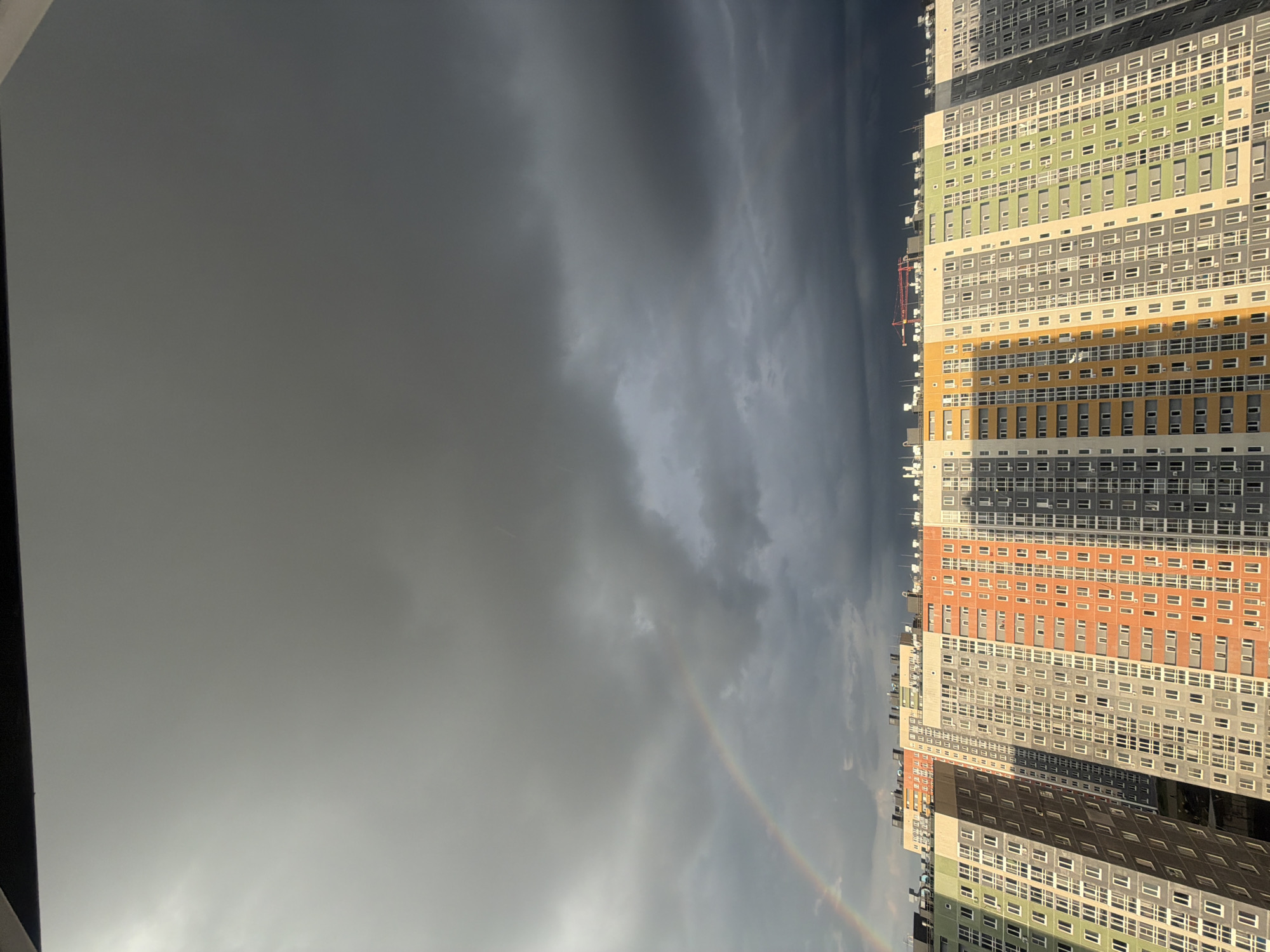 Stormy skies and rainbow observed over Ankudinovo apartments