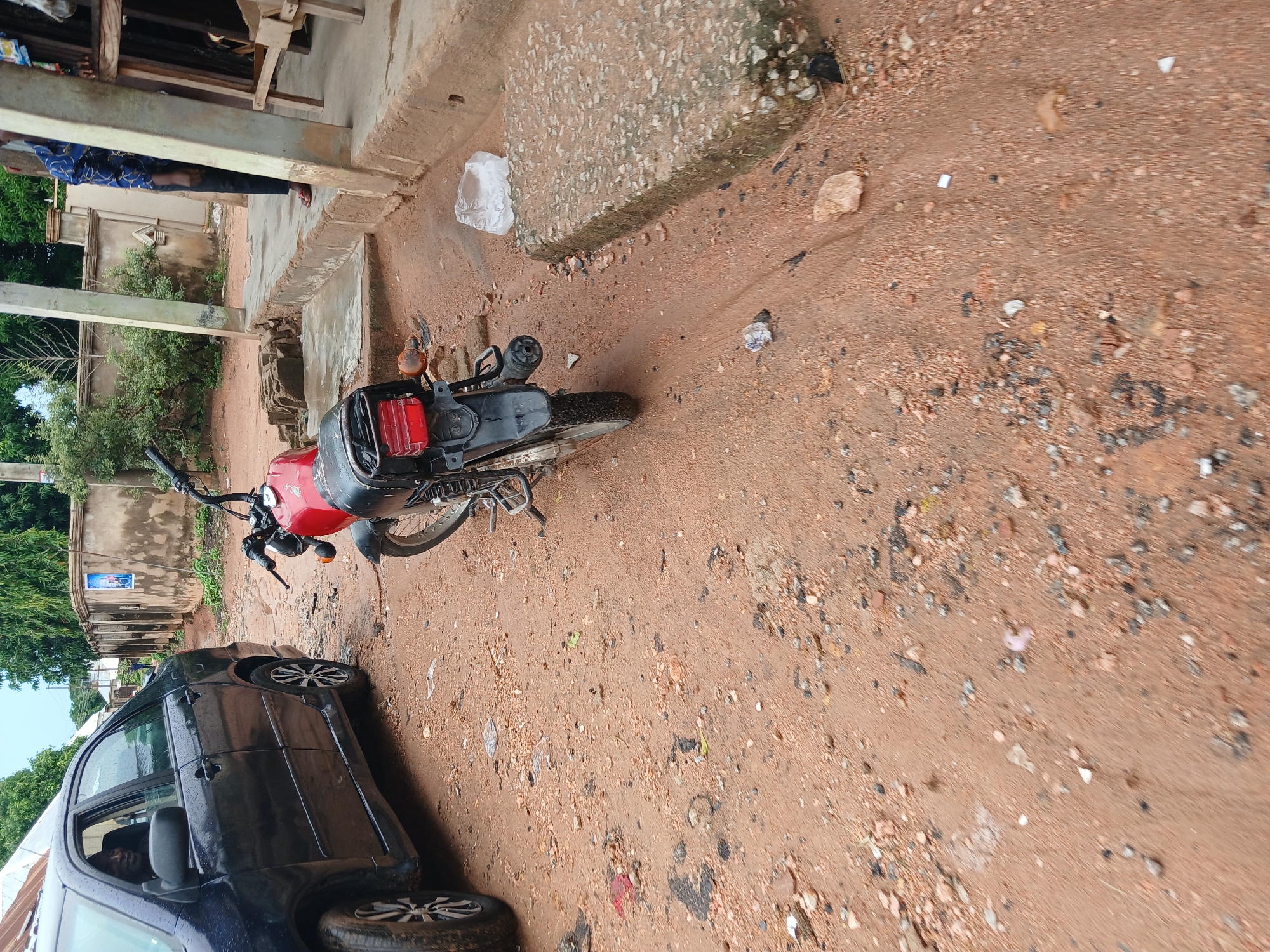 Inside a Jalingo tailor's workshop after the rain