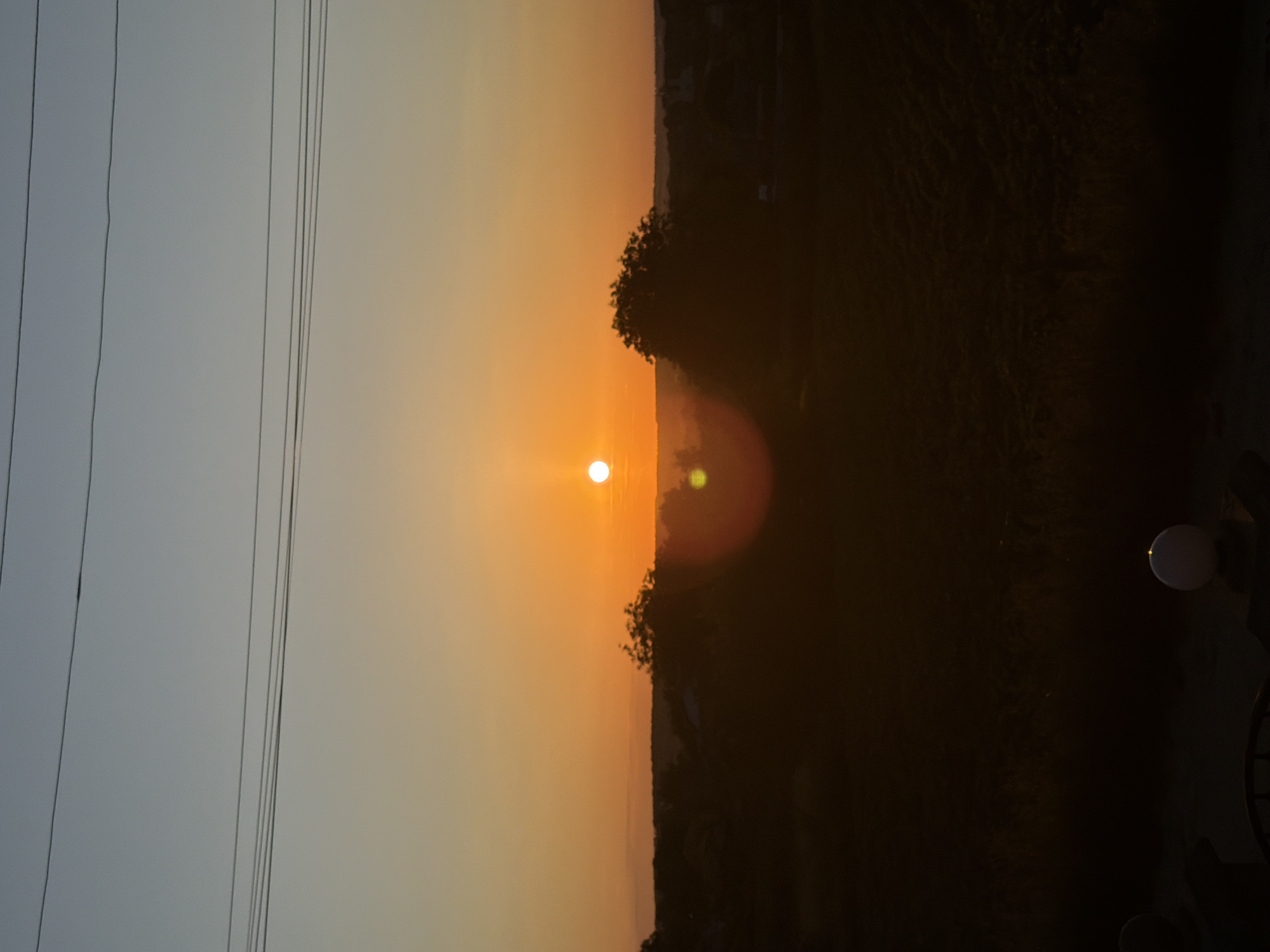 Rural sunset viewed from indoors and out