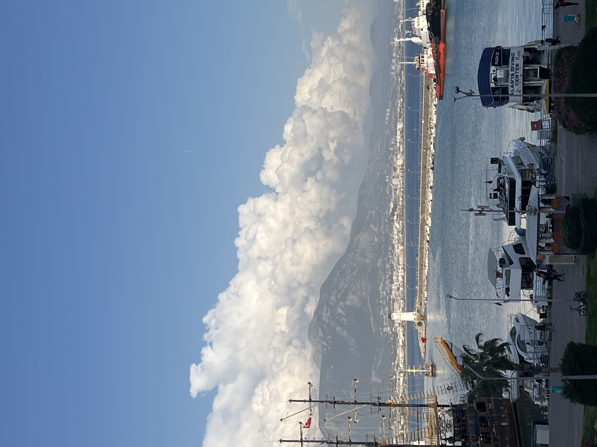 Tourist captures Alanya harbor views and nautical souvenir displays