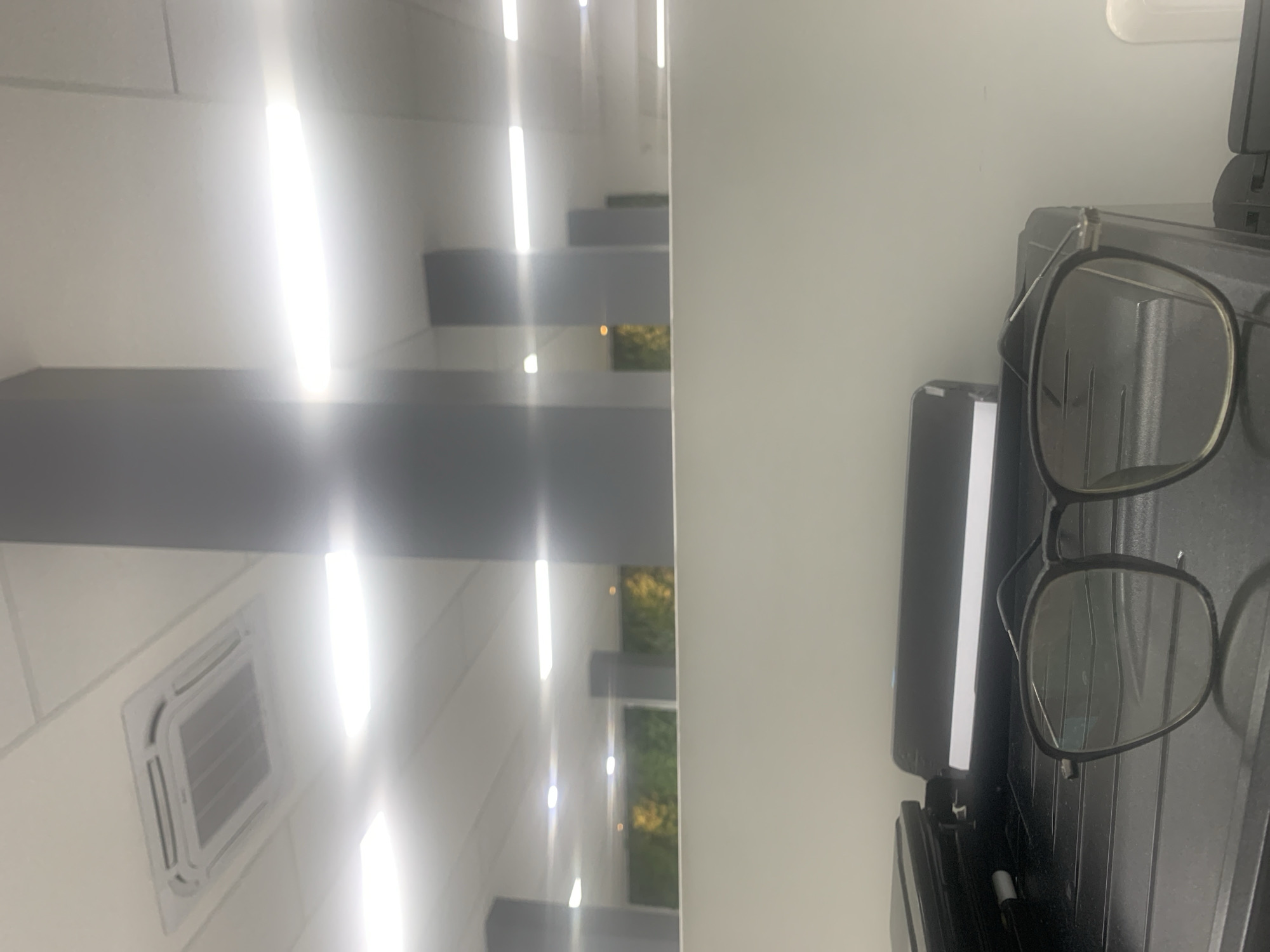 Office desk in Palembang: printer, branded thermos, quick selfies