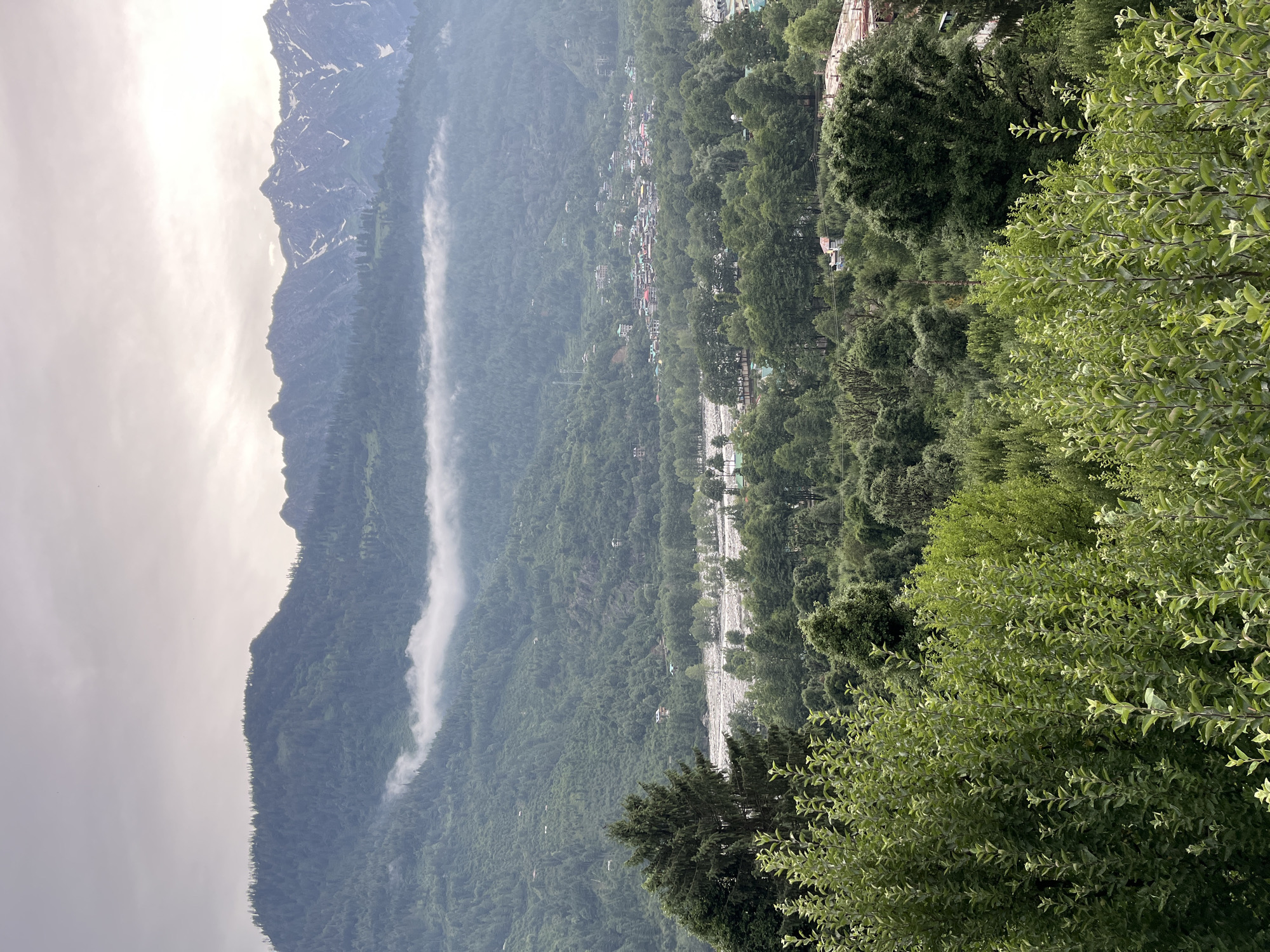 Cloudy afternoon views across Vashisht valley and the Himalayas
