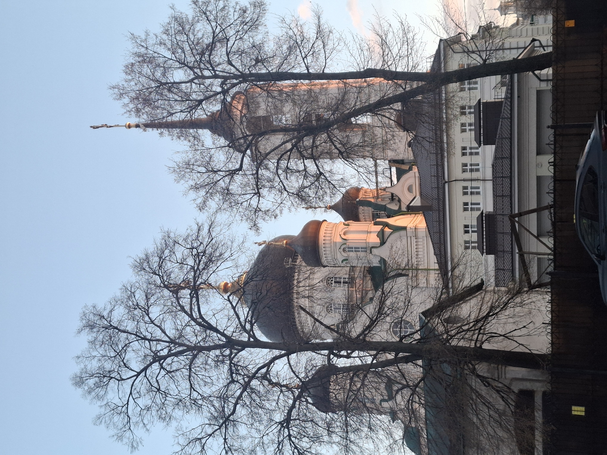 Orthodox cathedral complex observed during evening hours in urban park