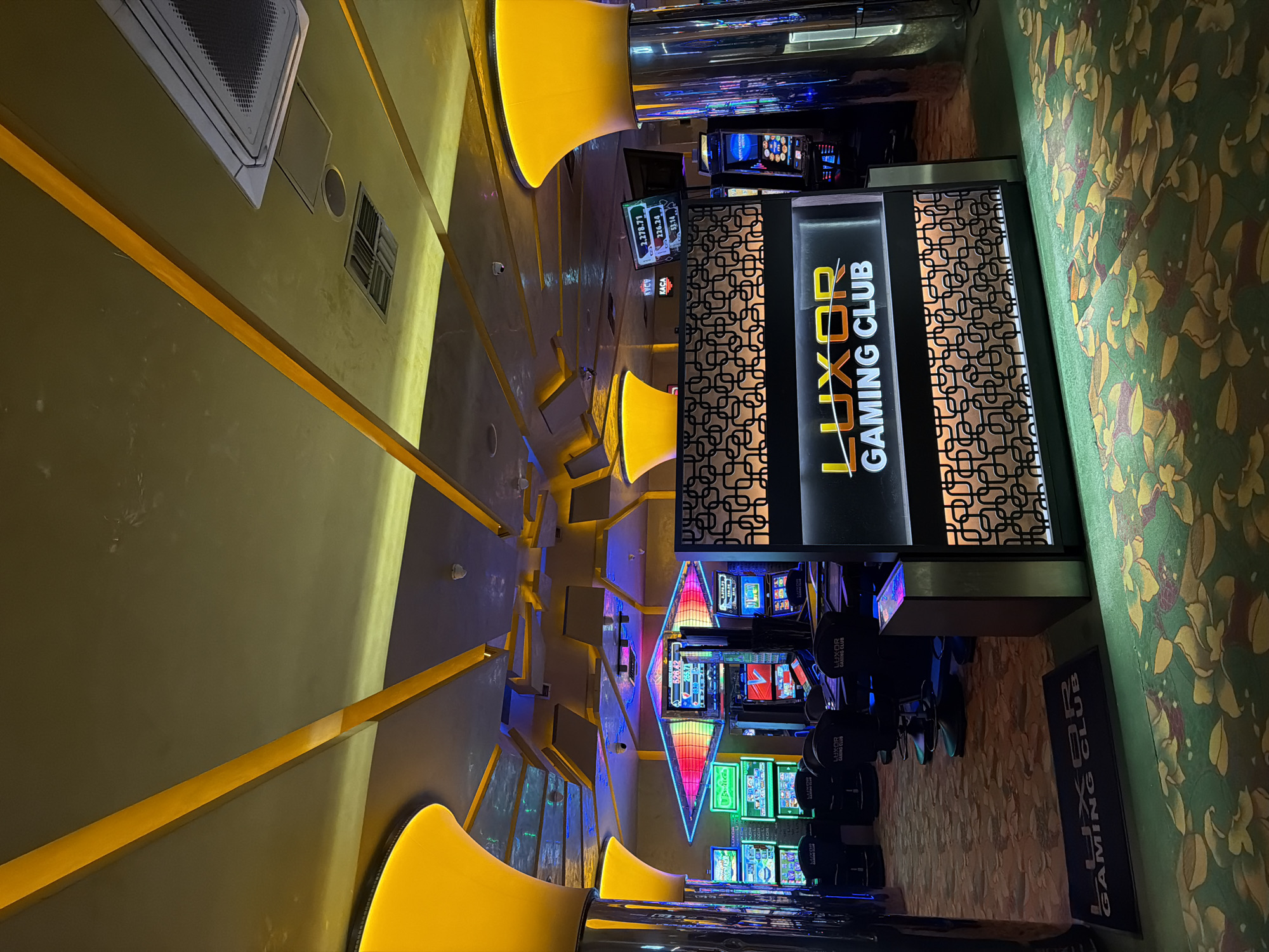 Gaming club interior captured with illuminated displays and machines