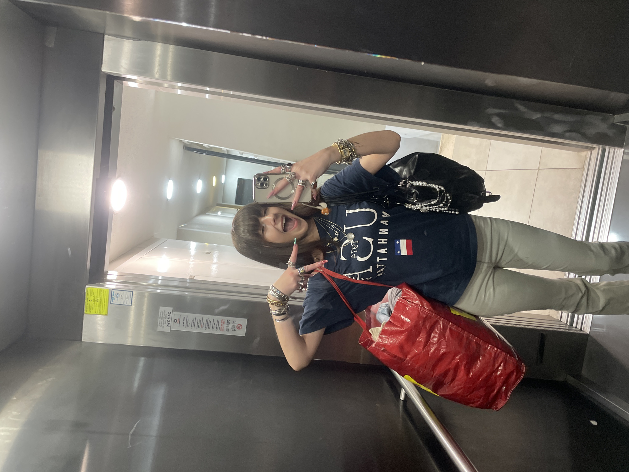 Woman captures joyful elevator selfie in Raanana