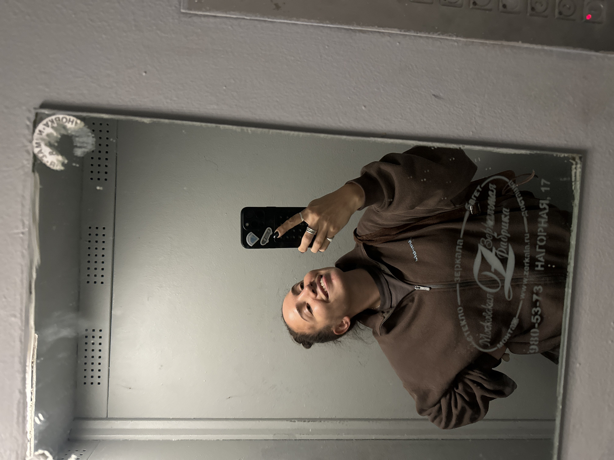 Woman takes selfie in branded mirror in Moscow