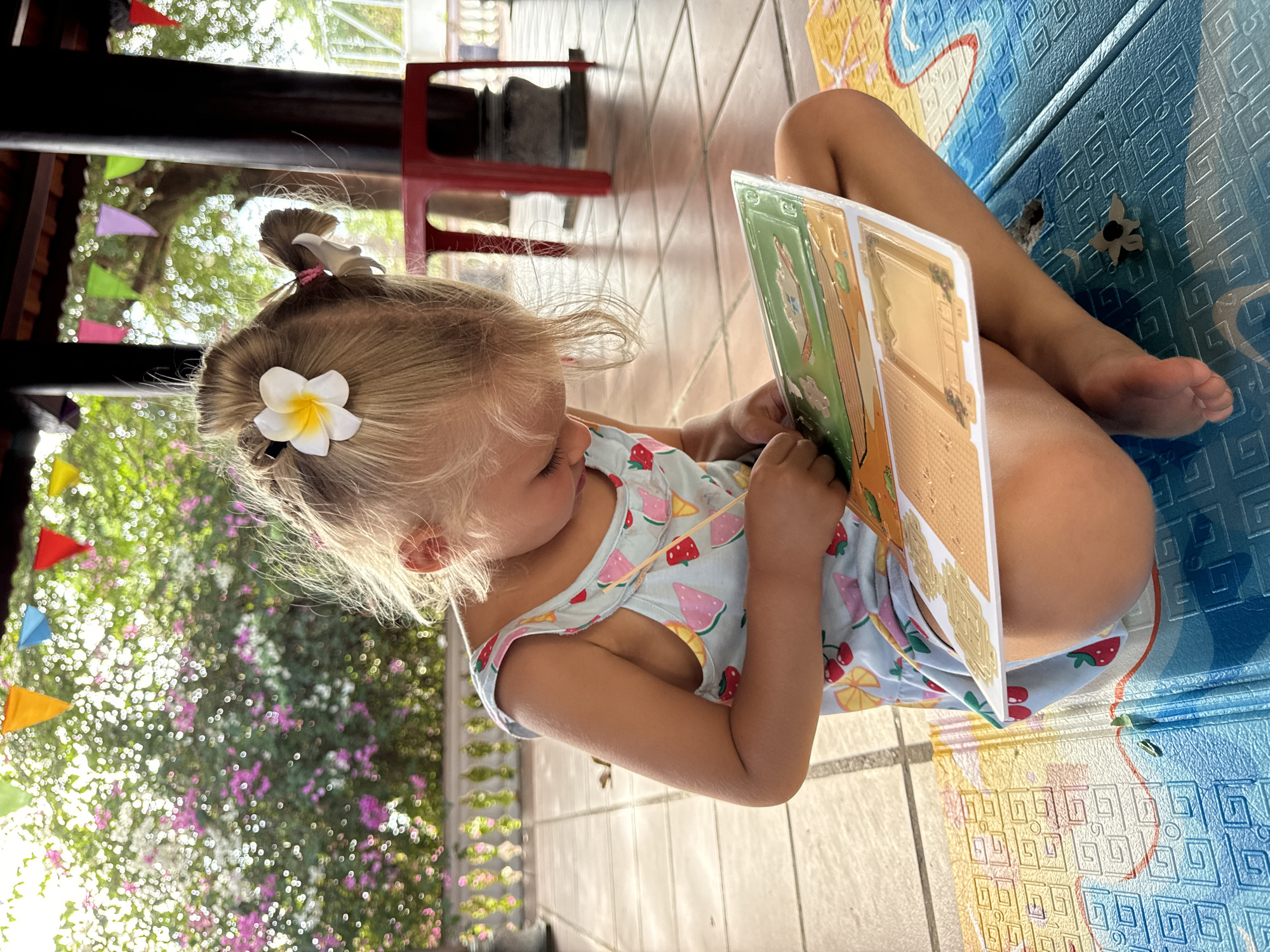 Children's reading and play time captured in Mũi Né