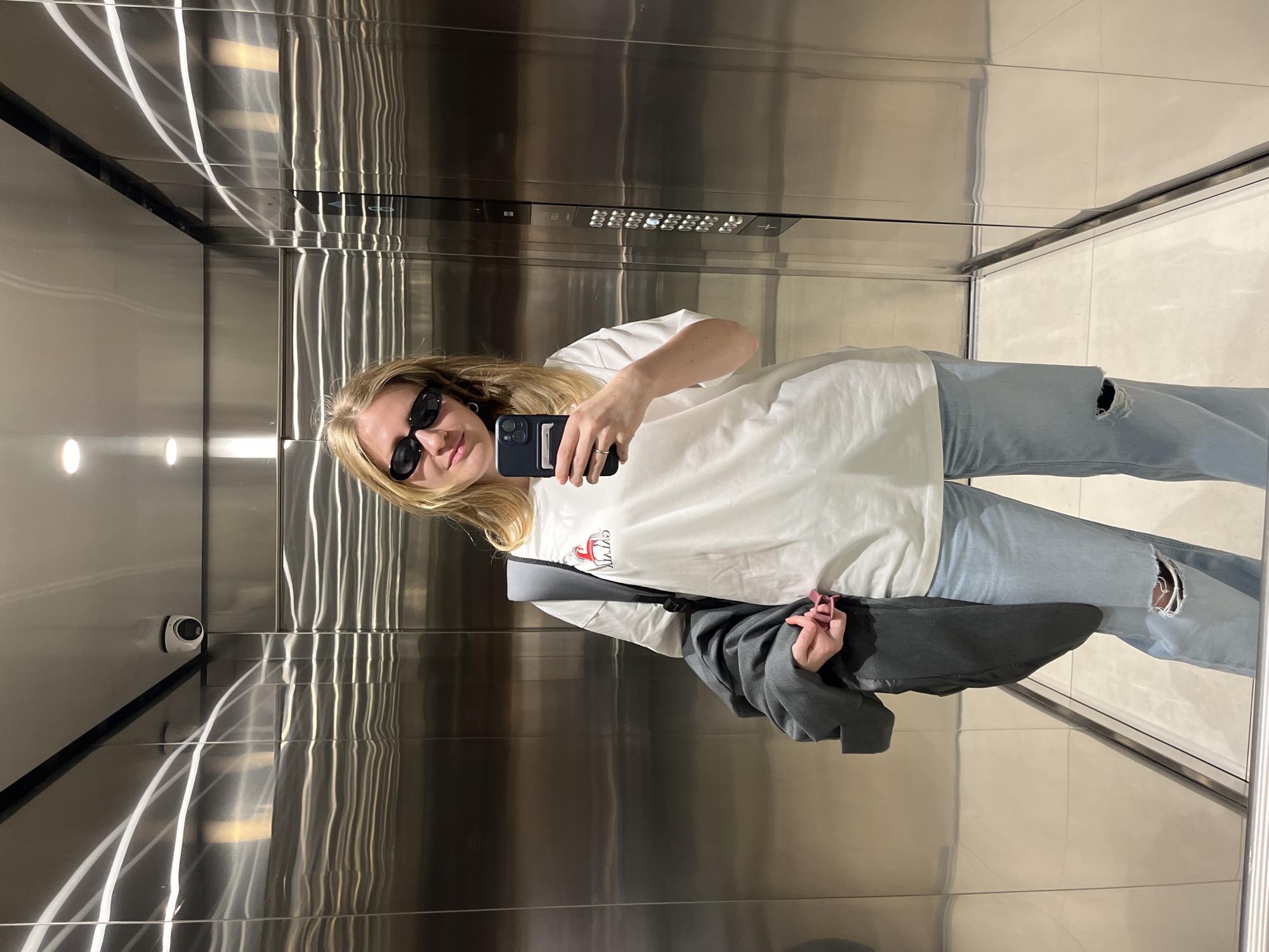 Woman takes elevator selfie in Belgrade
