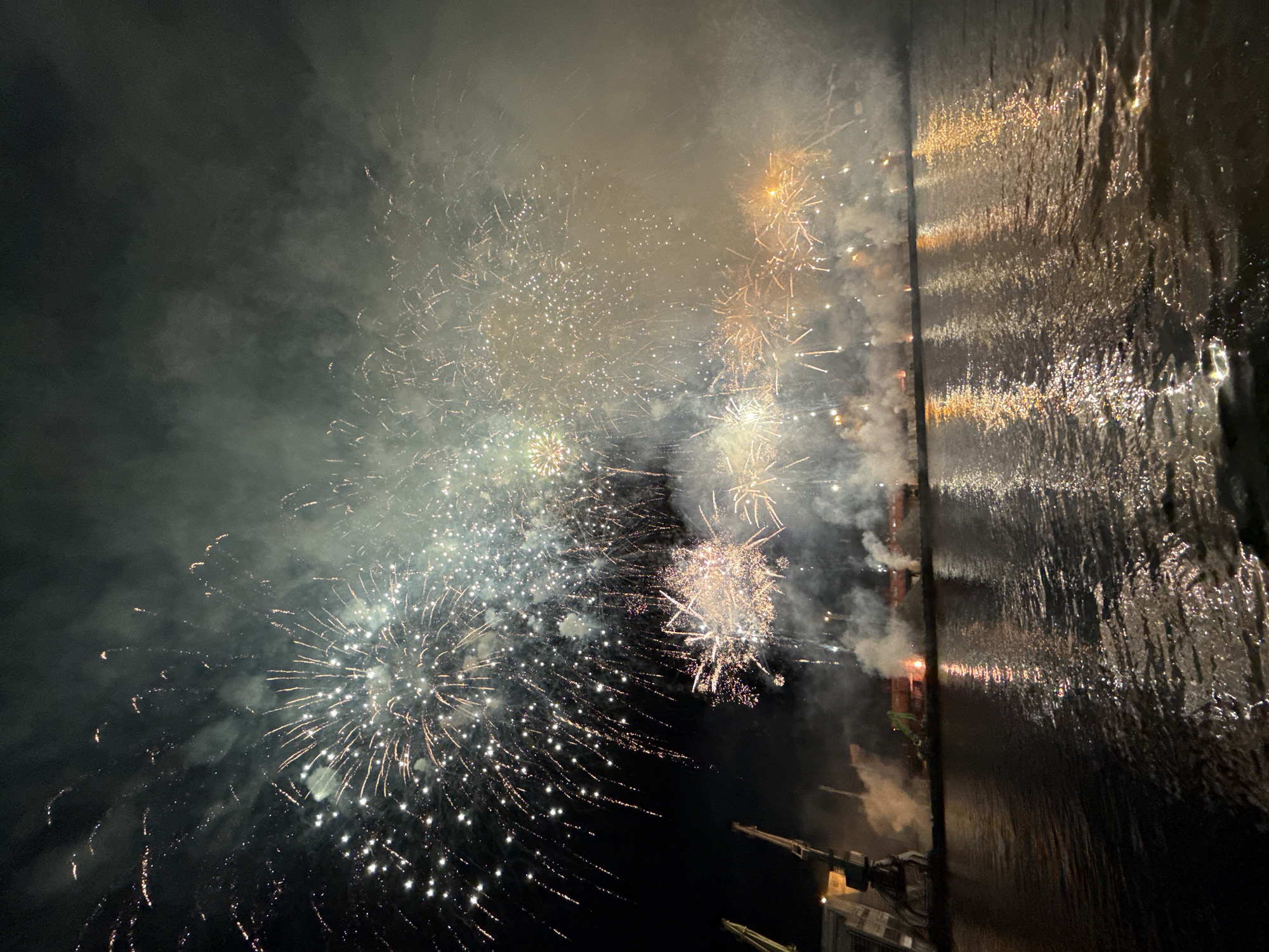 Colorful fireworks light up Ventspils harbor at night