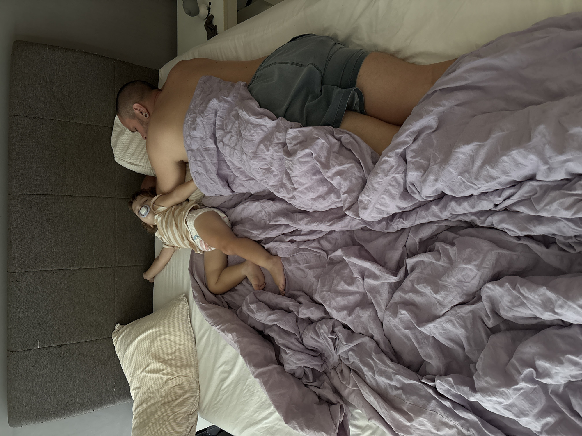 Peaceful nap time under a light purple duvet in Choeng Thale