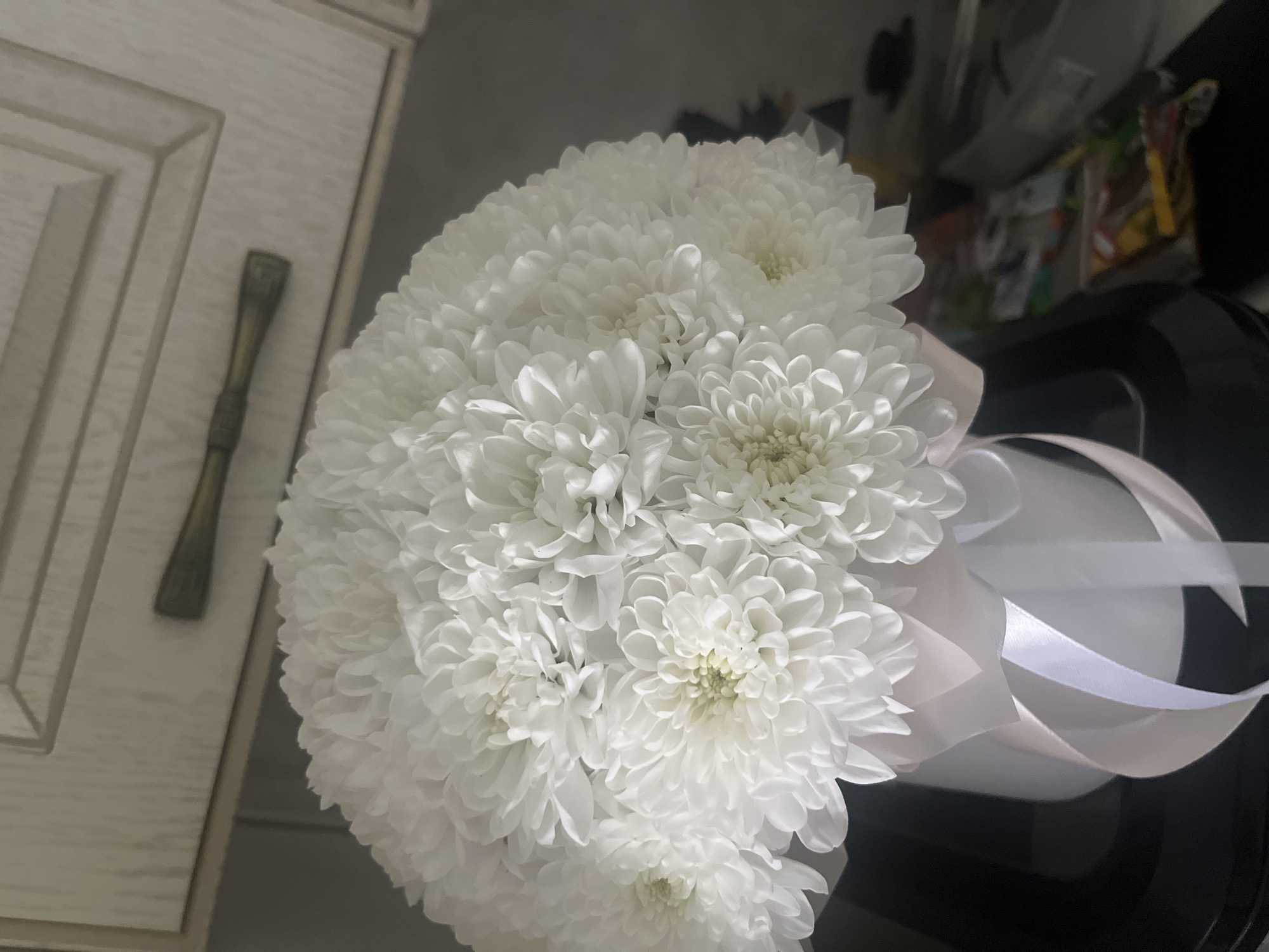White chrysanthemum bouquets and animal art in Tyumen