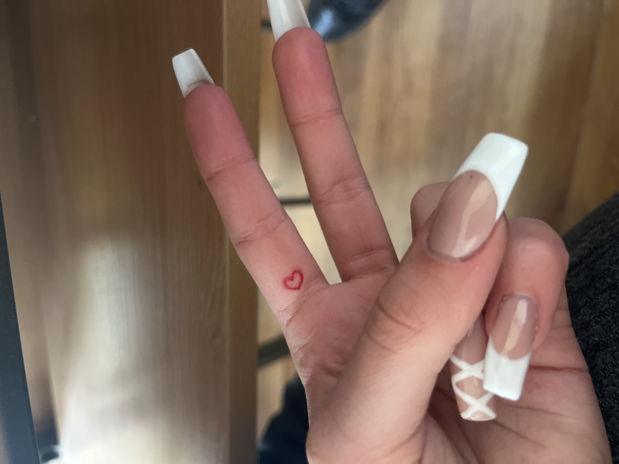 Student's elaborate manicure documented during Bulgarian classroom session