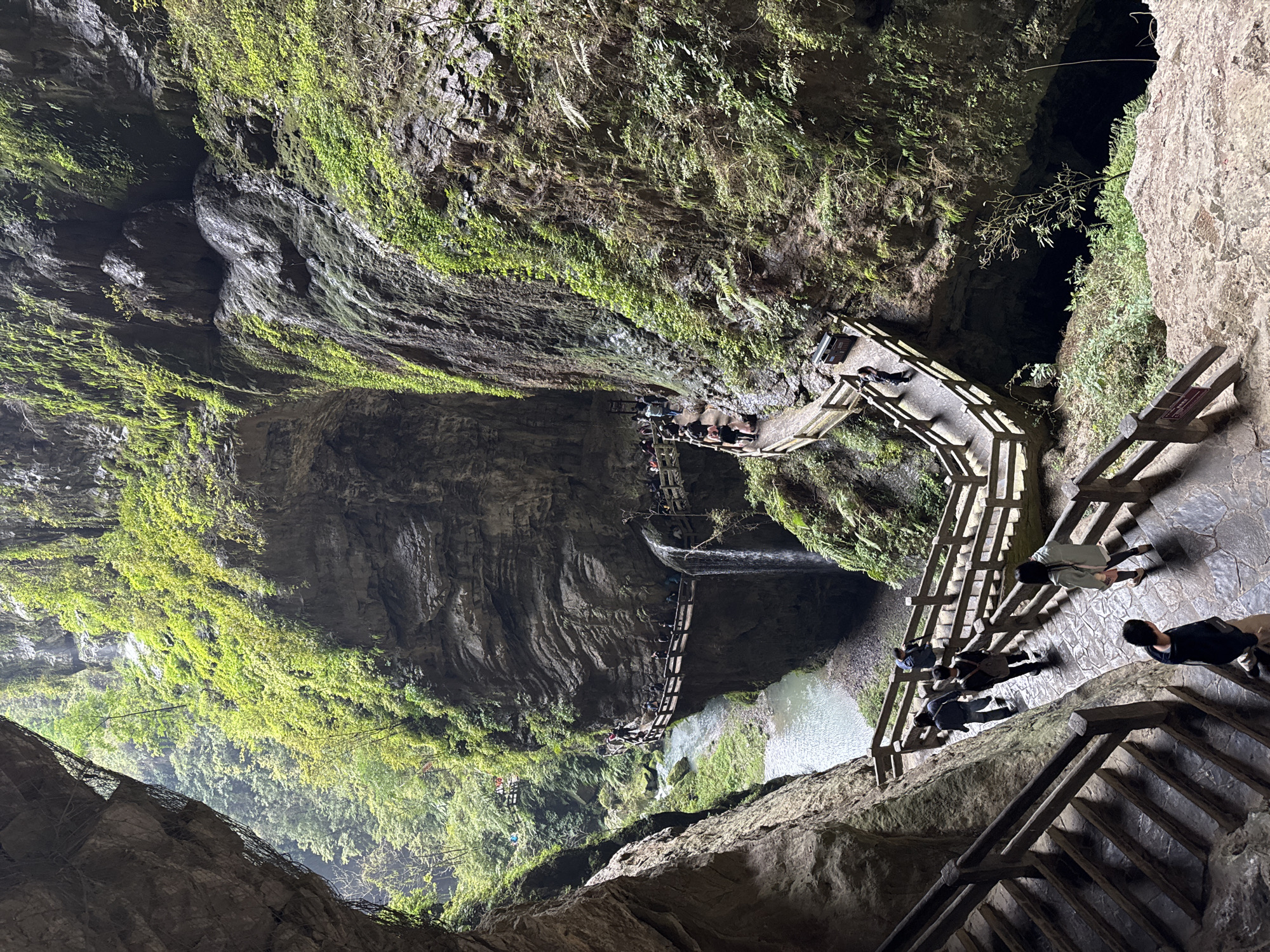 Tourists explore waterfalls and caves in Wulong District, China