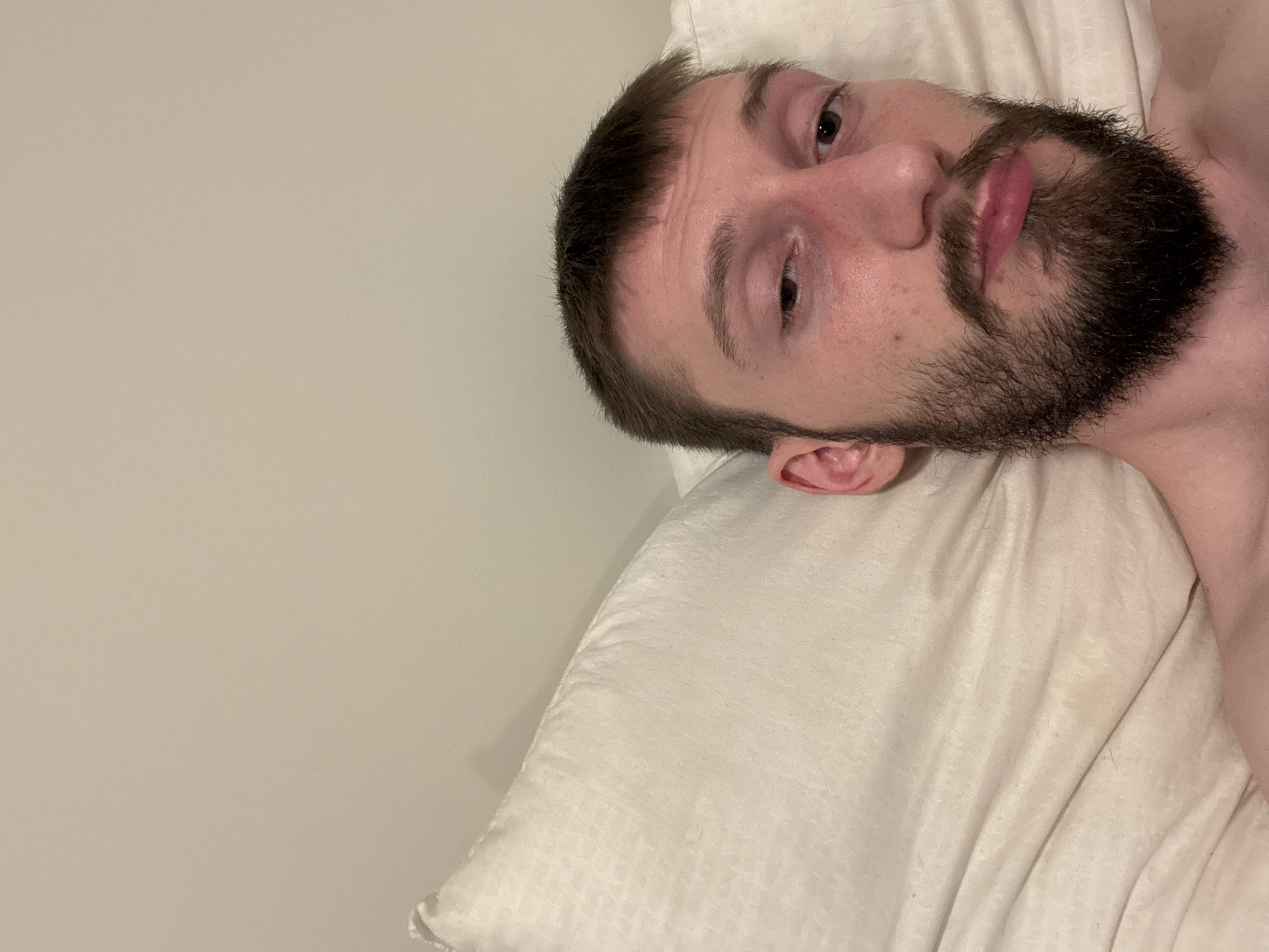 Man resting on pillow observed in Finnsnes, Norway