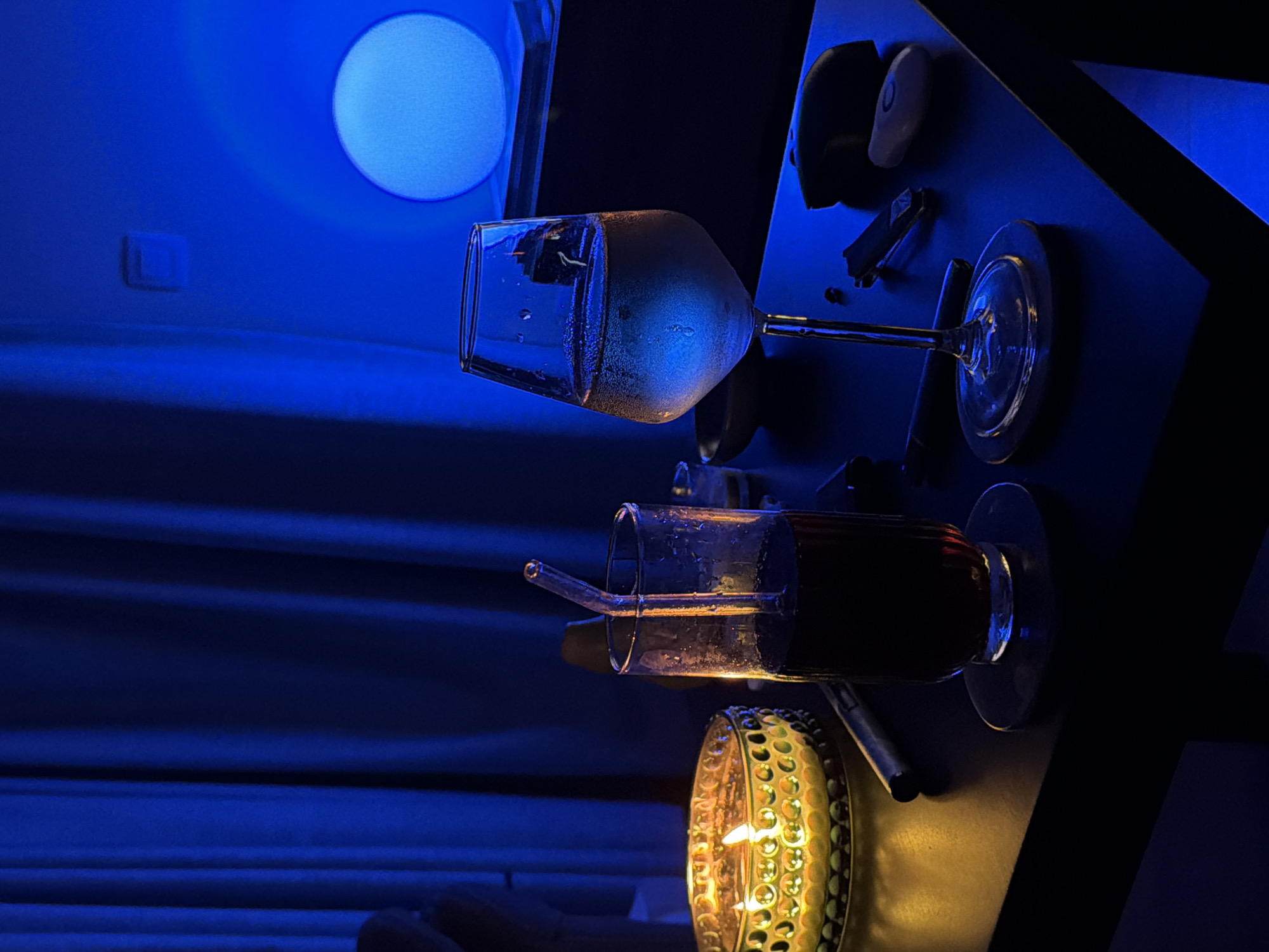 Golden candle glows in dimly lit Sofia interior