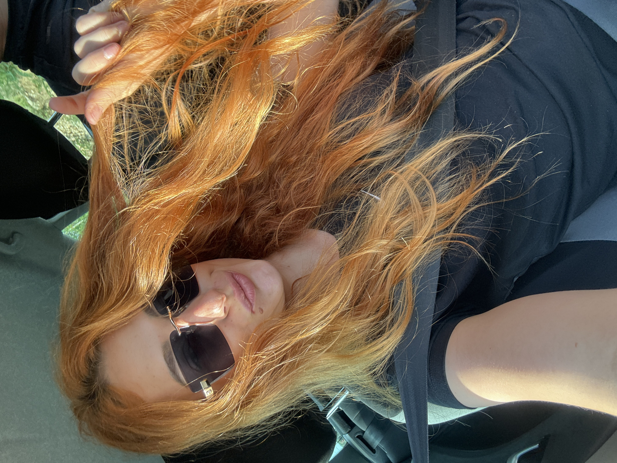 Red-haired passenger spotted making playful gestures in Montenegro car