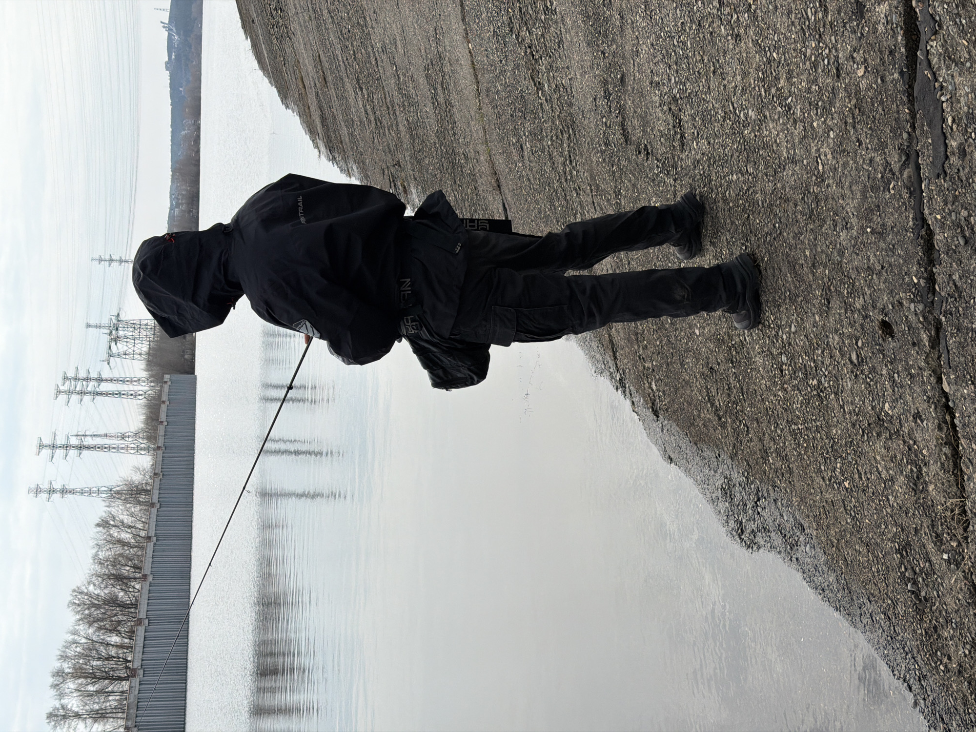 Angler fishes Kama River through ice in Chaikovsky, Russia