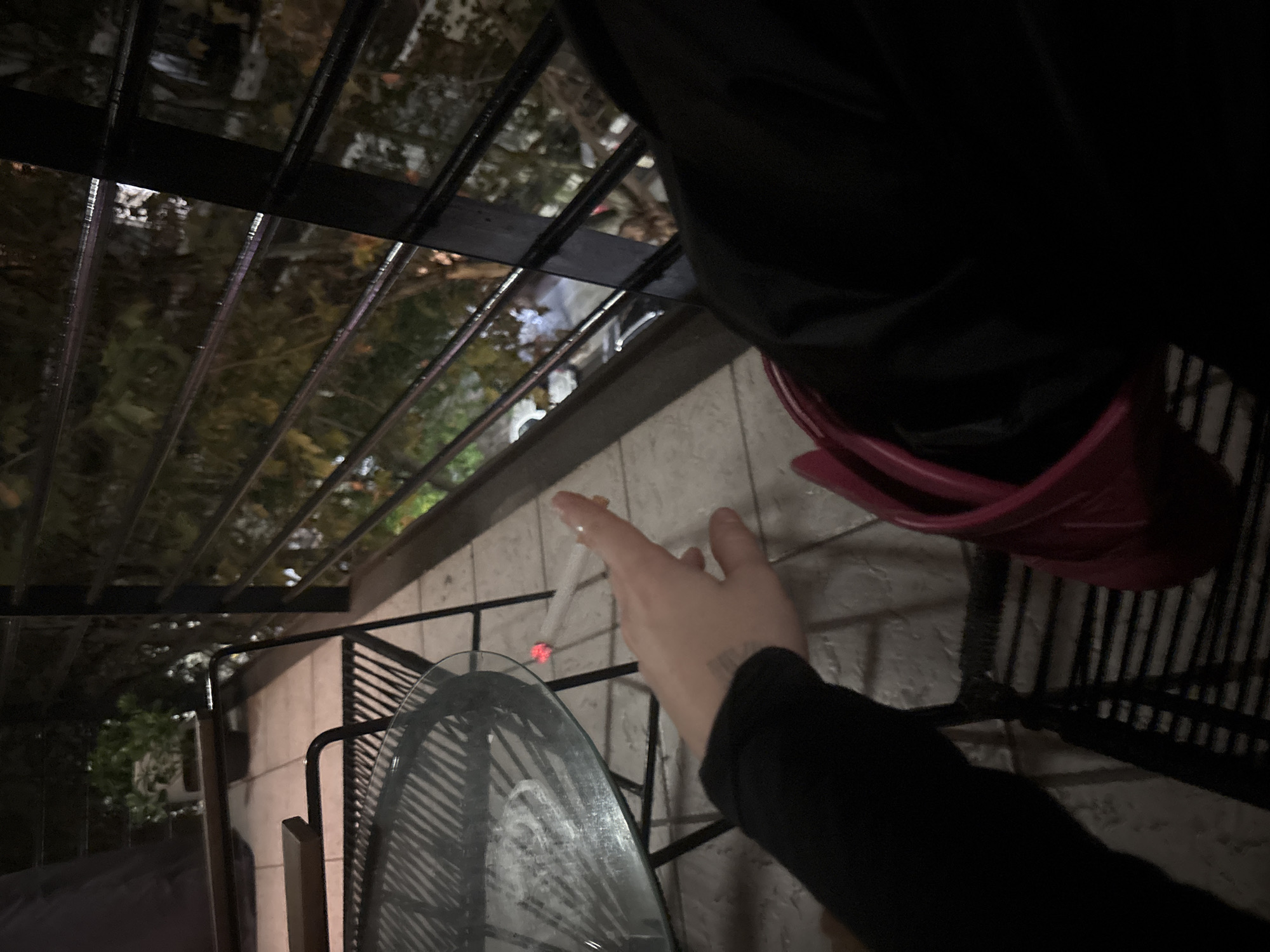 Early morning smoking break observed on Buenos Aires balcony