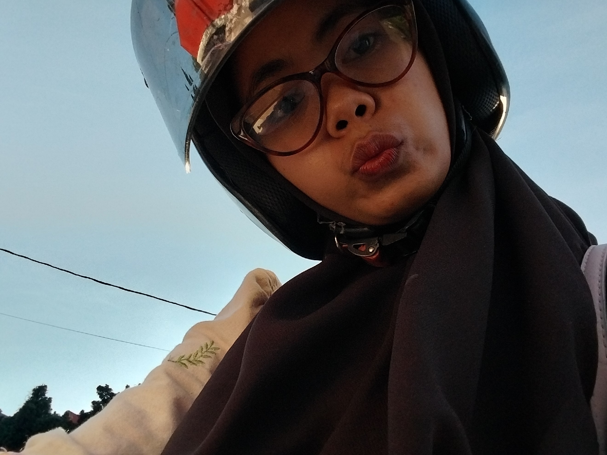 Motorcycle selfies and gas station scenes in Macege, Indonesia