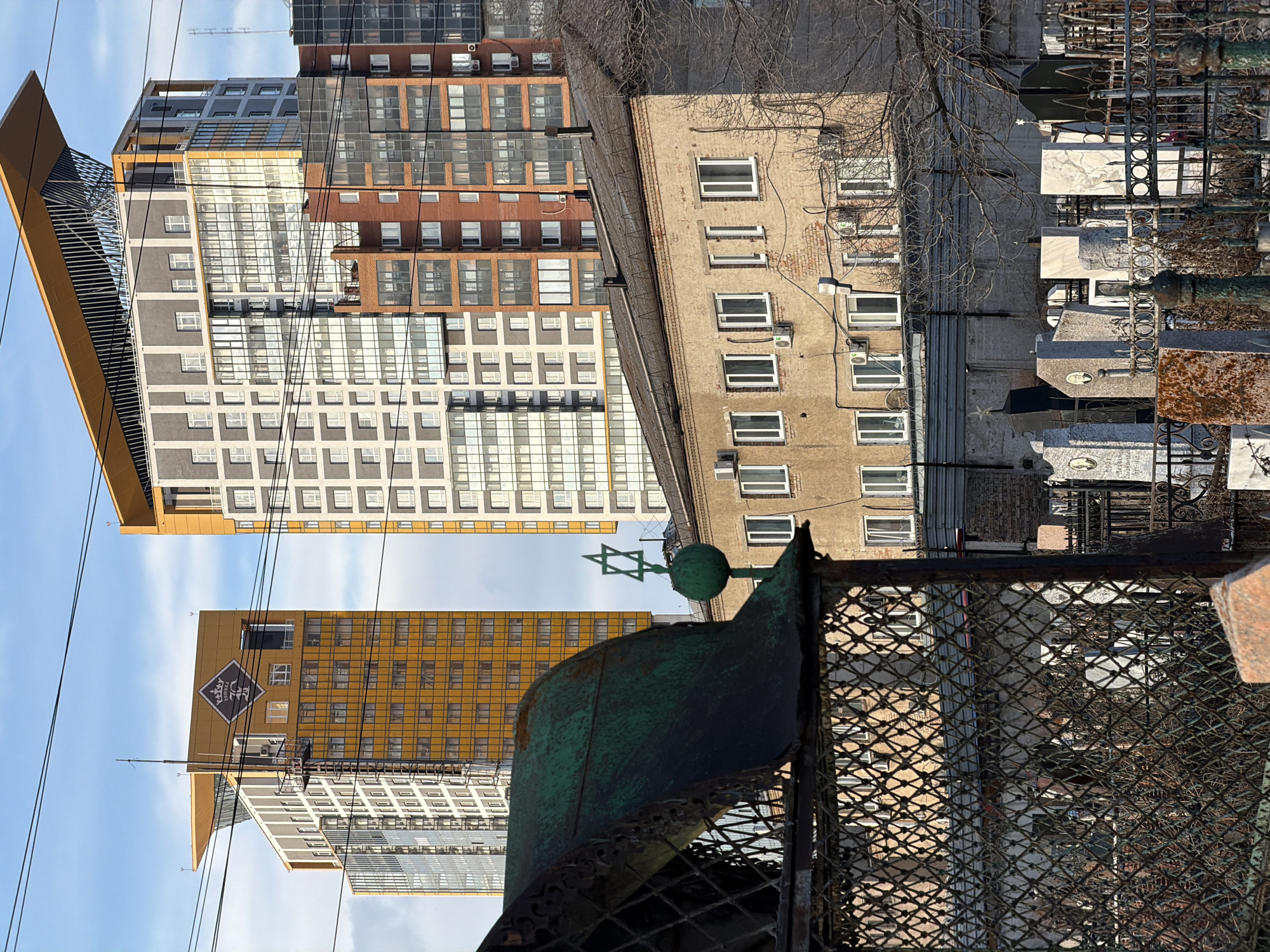Morning scenes documented across Krasnoyarsk including cemetery, monument, construction