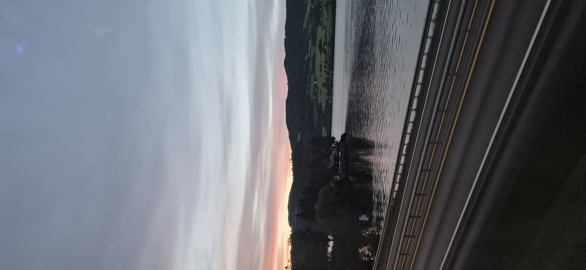 Dusk over Biri — soft sky, power lines, and still water