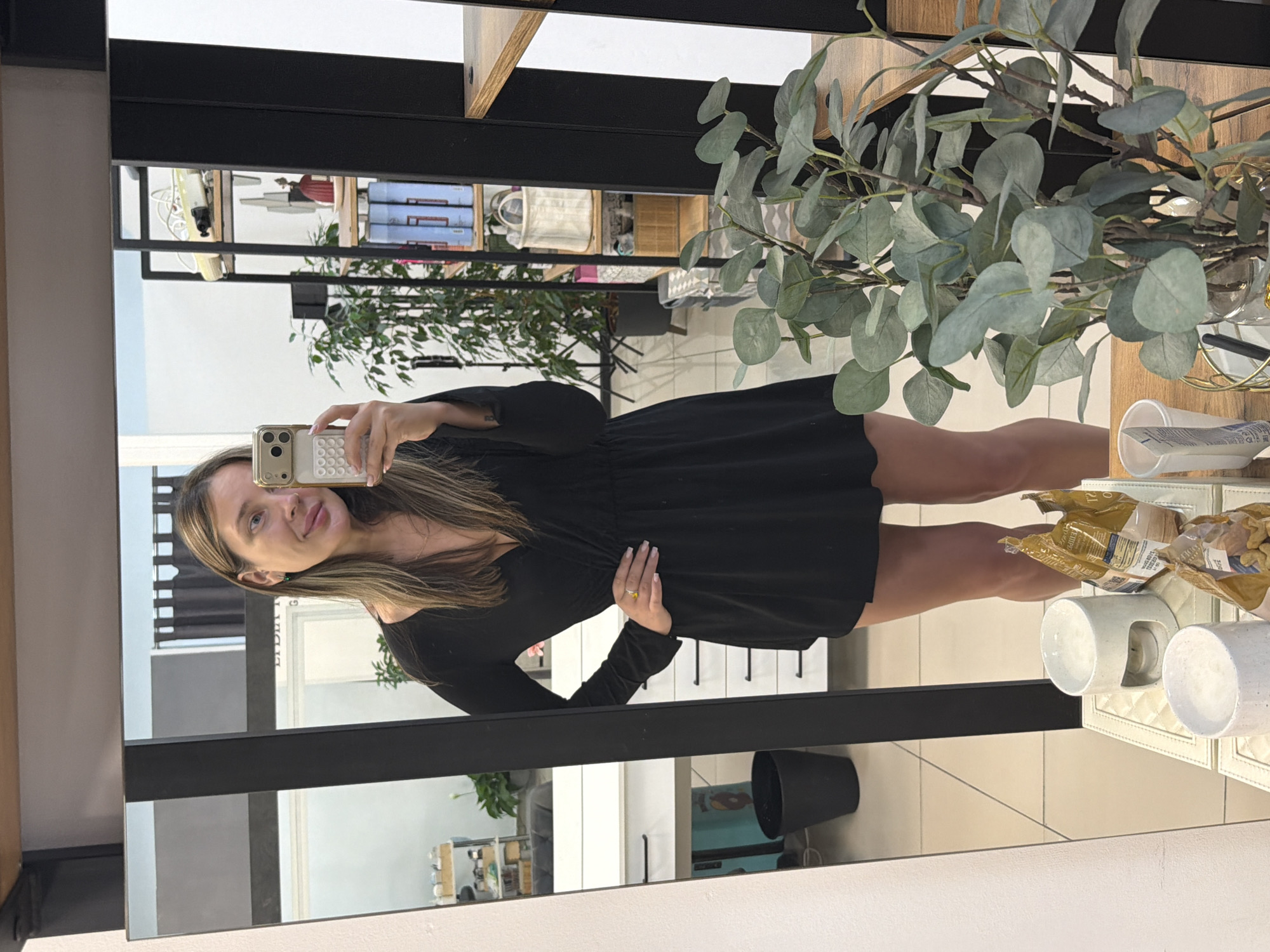 Evening in Chaikovsky, indoors and out, black dress throughout.