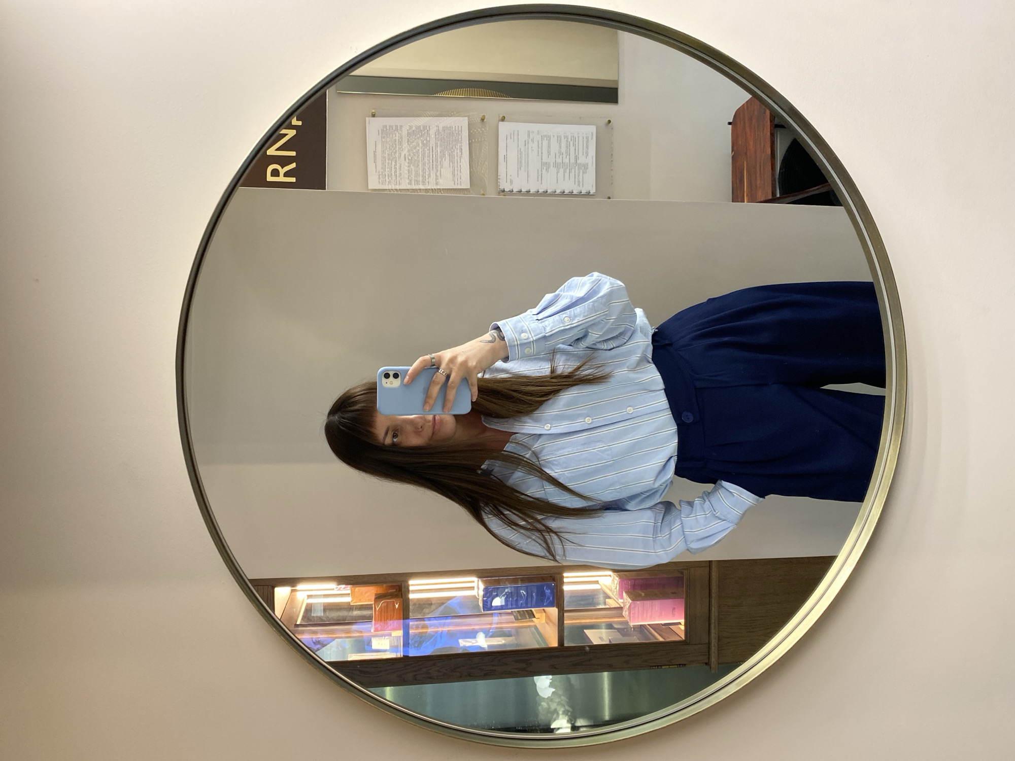Woman takes mirror selfie at Votkinsk retail location