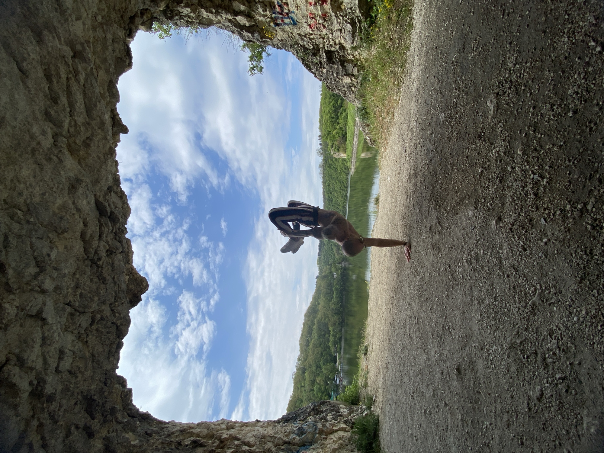 Man performs yoga poses near lake in Pleven, Bulgaria