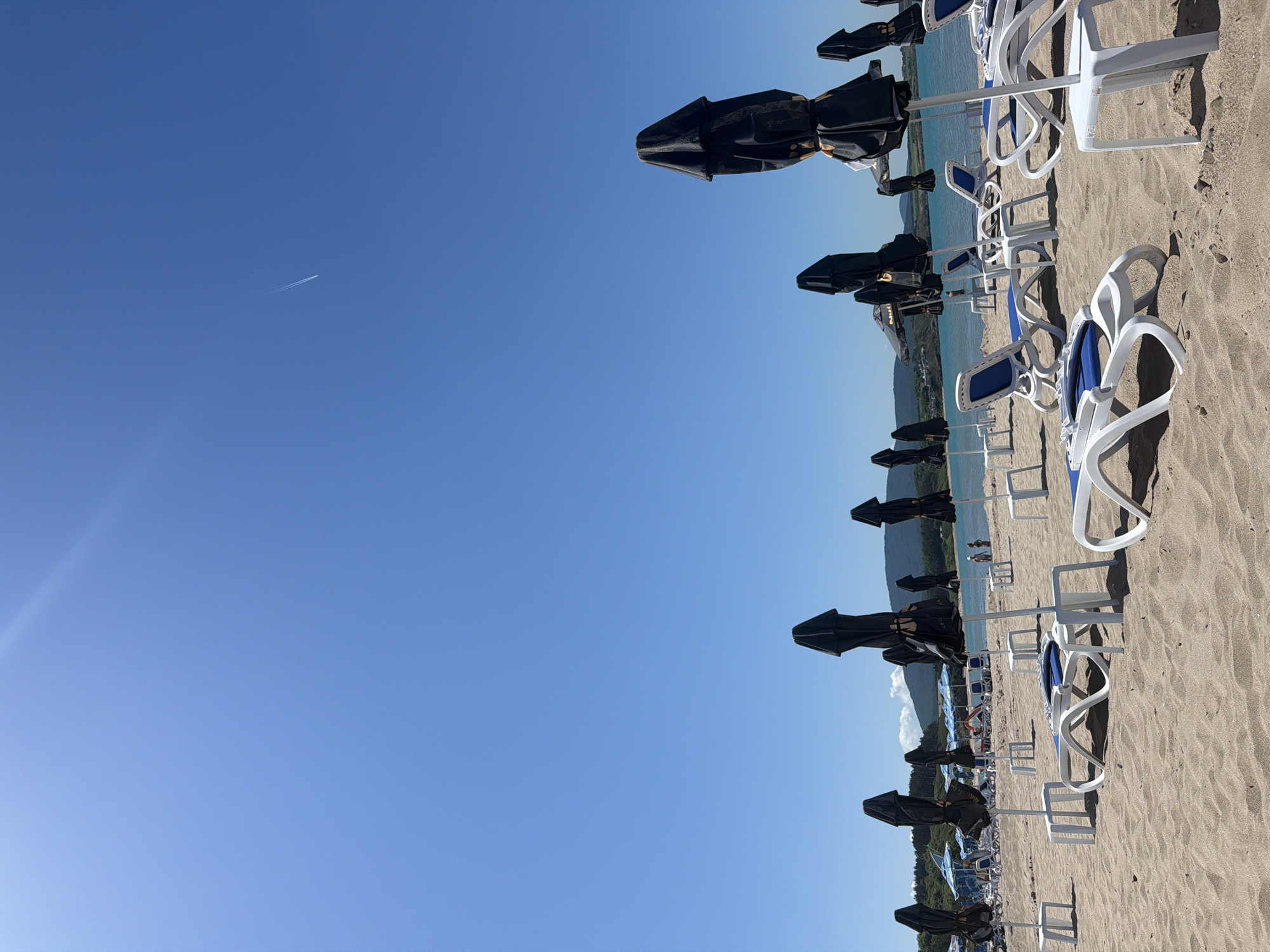 Empty beach umbrellas and loungers captured at Ahtopol Bulgaria