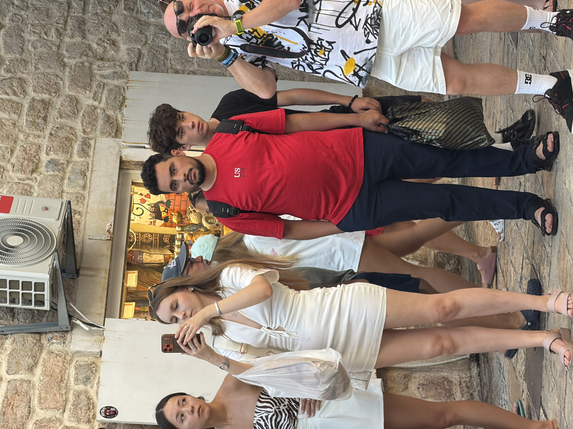 Afternoon foot traffic fills Budva's old town cobblestone streets