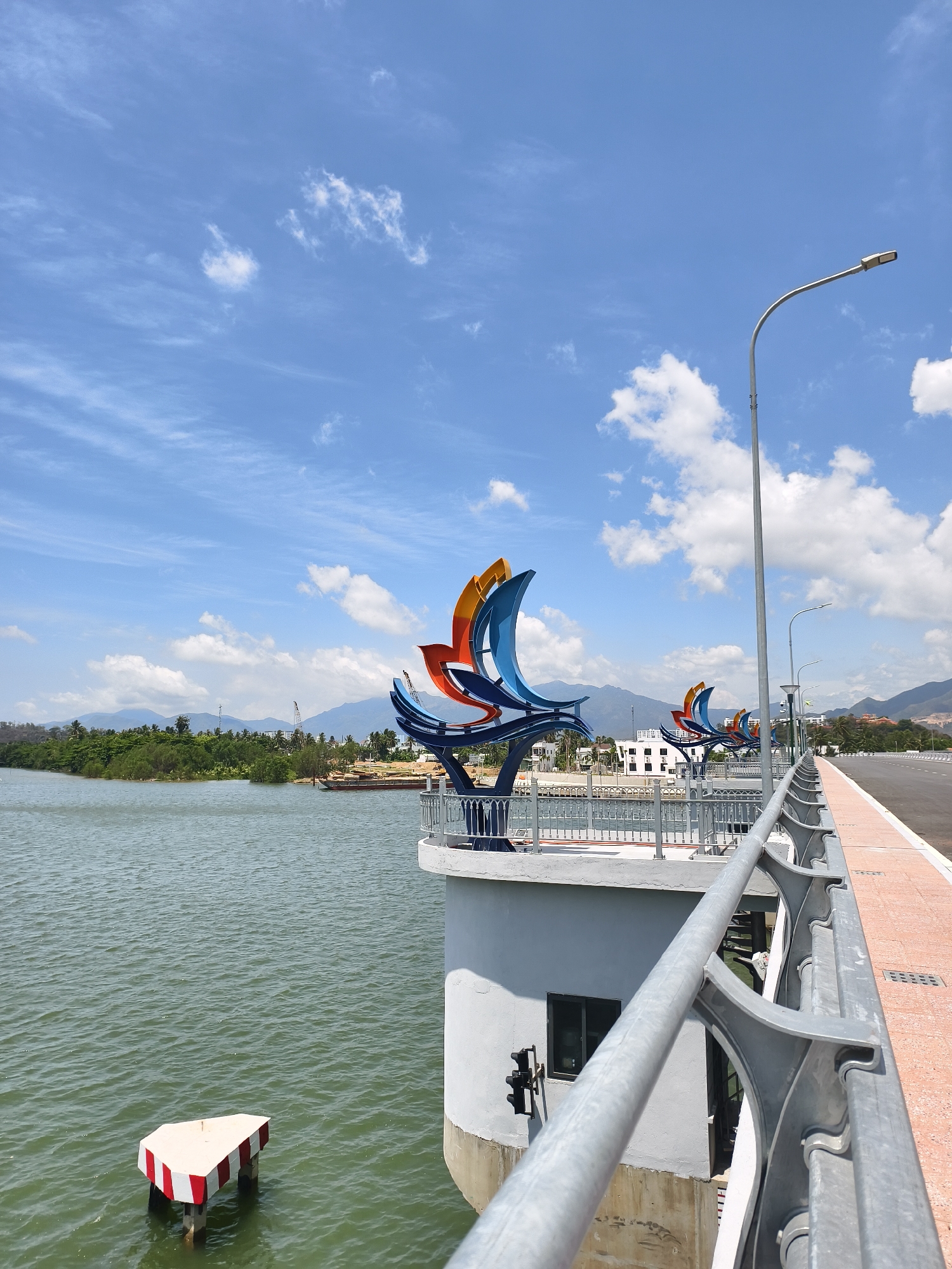 Colorful sail sculptures documented on Vietnam pedestrian bridge