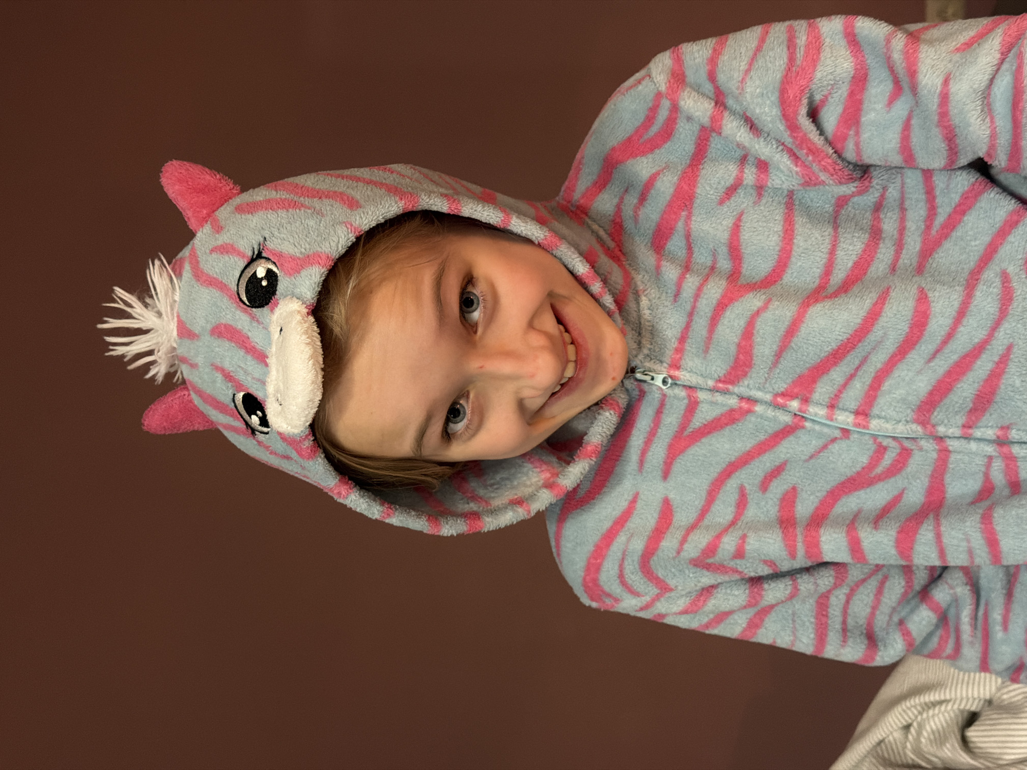 Child in unicorn onesie photographed in Dreiliņi, Latvia